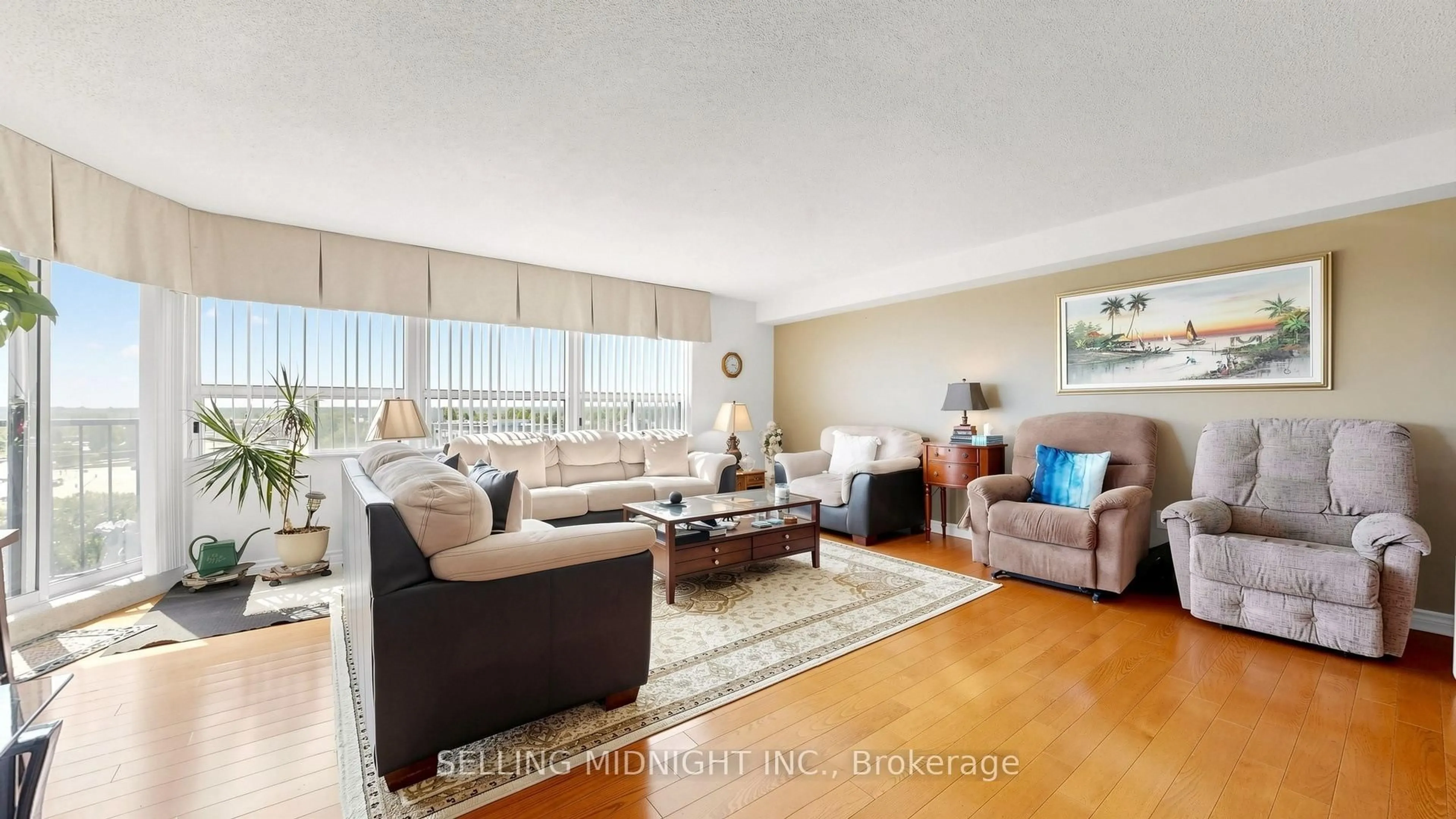 Living room with furniture, wood/laminate floor for 2 Raymerville Dr #818, Markham Ontario L3P 7N7