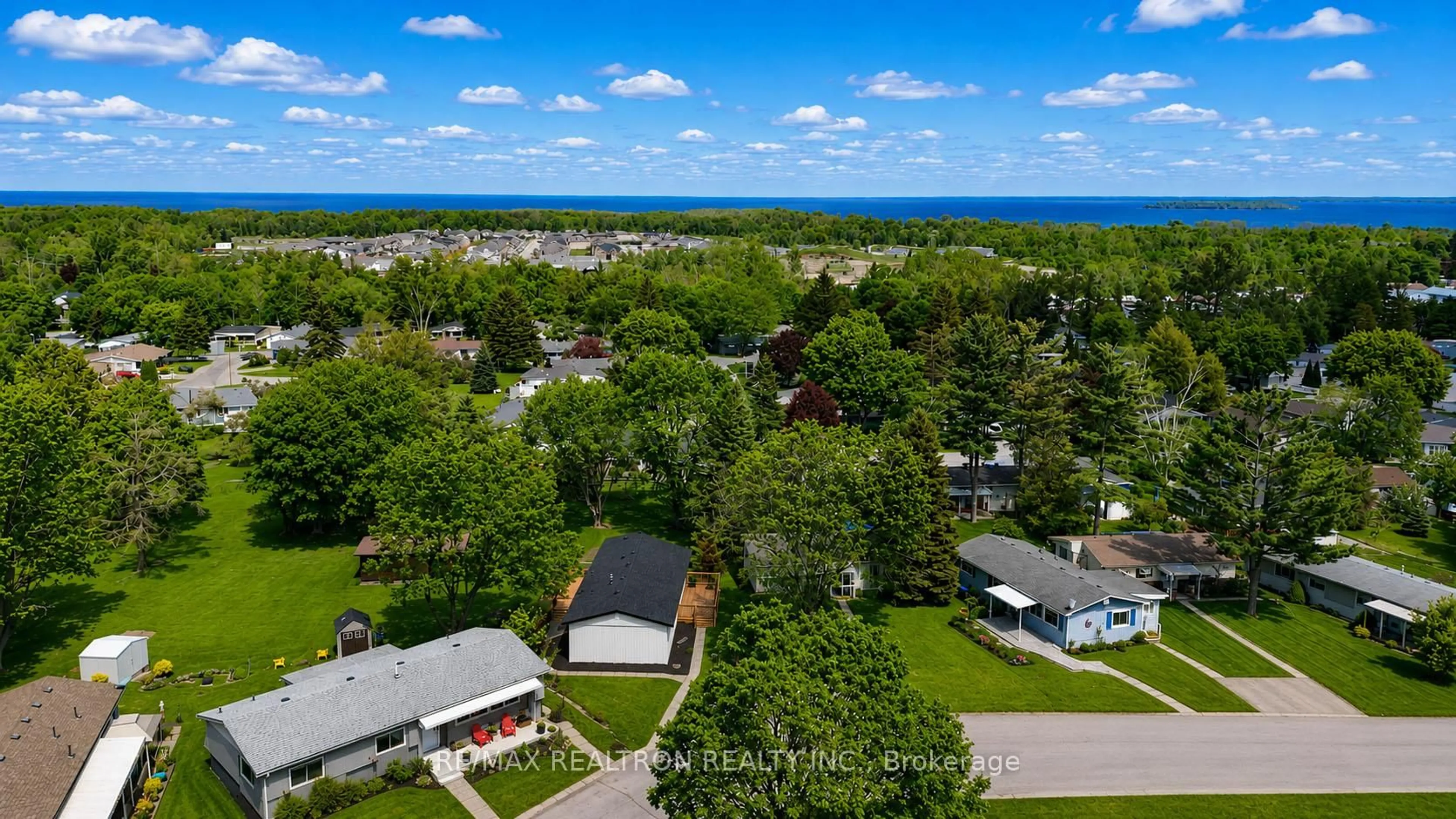 A pic from outside/outdoor area/front of a property/back of a property/a pic from drone, water/lake/river/ocean view for 41 Trefoil Dr, Innisfil Ontario L9S 1P7