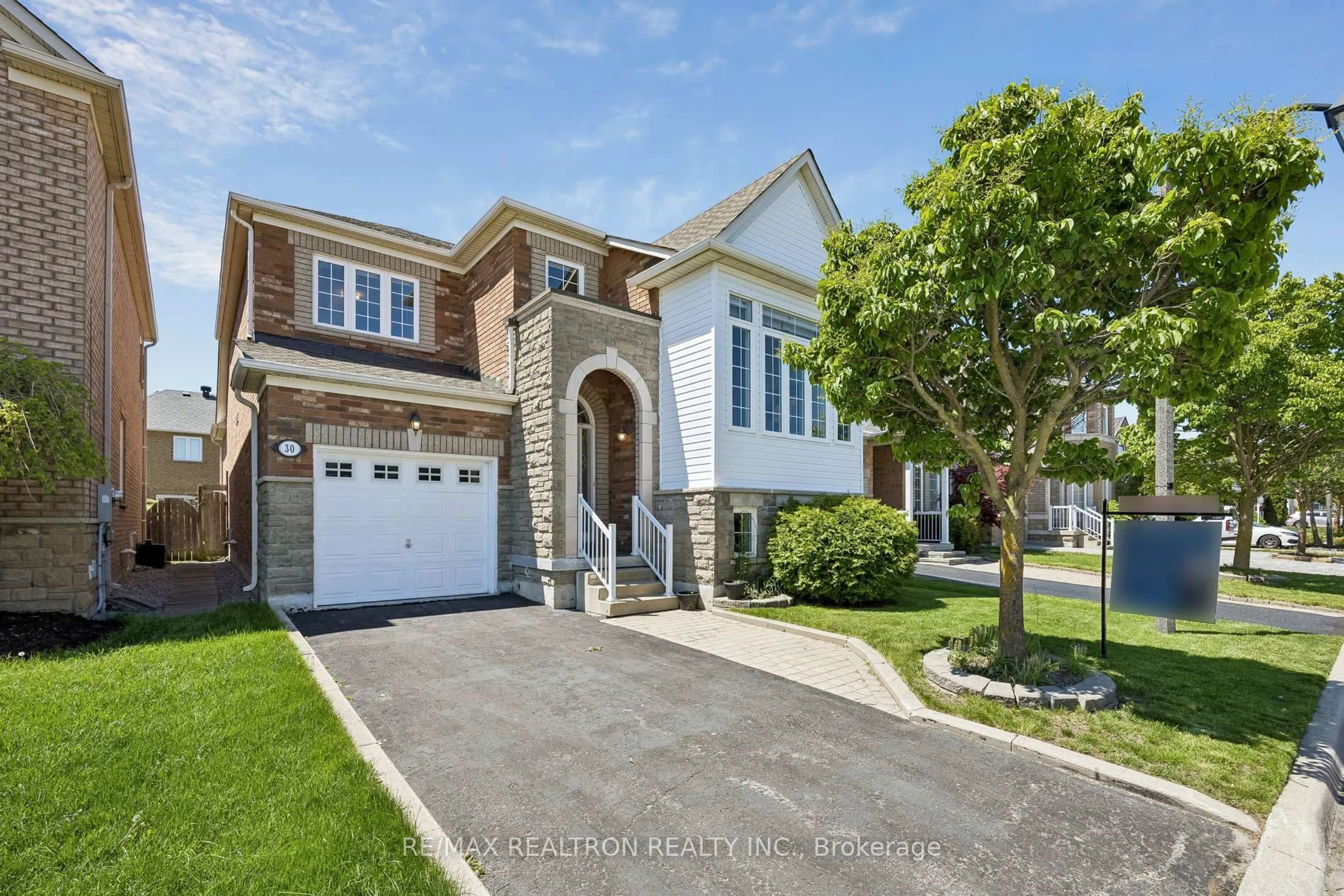 Home with brick exterior material, street for 30 Trelawny Rd, Markham Ontario L6E 1J8