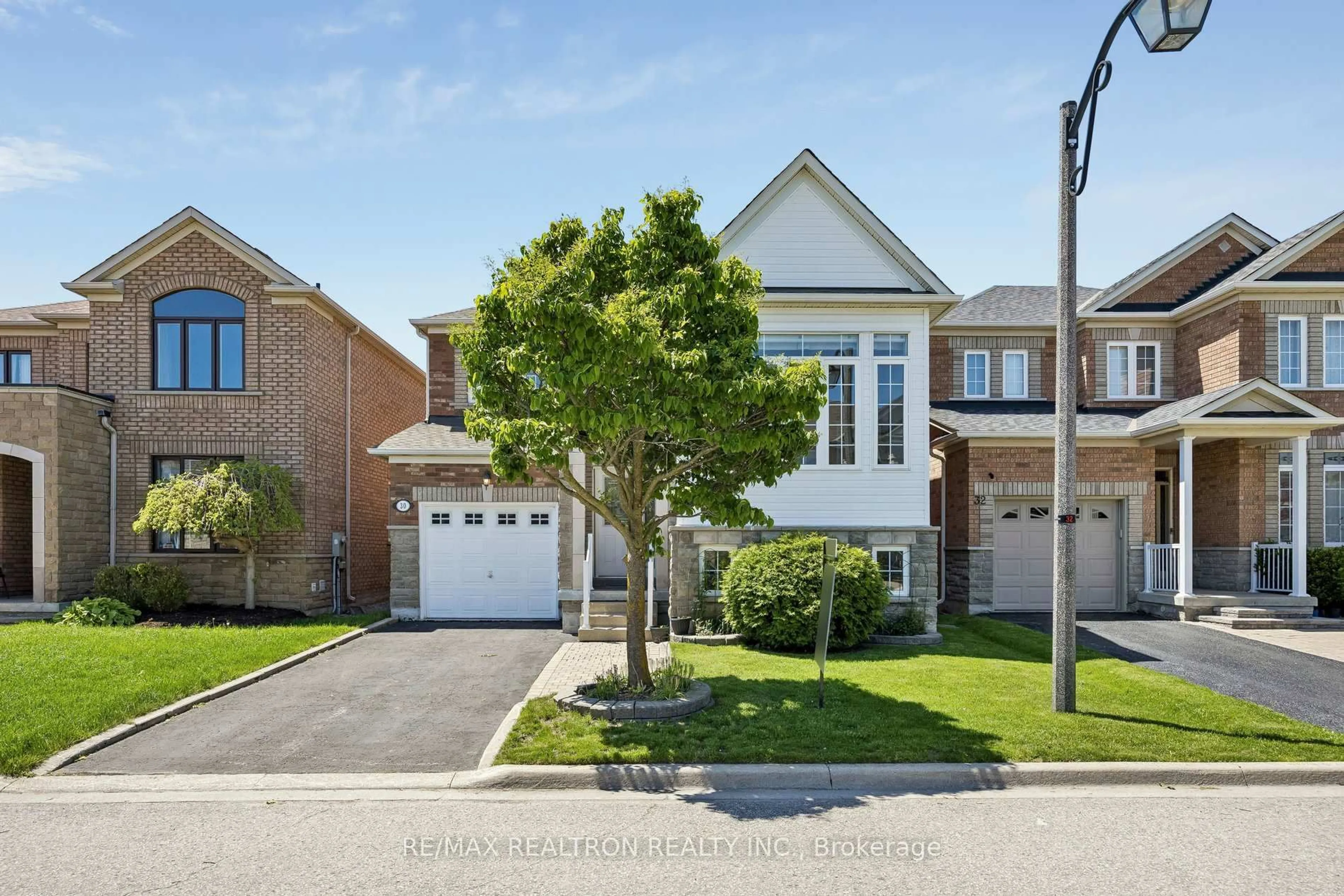 Home with brick exterior material, street for 30 Trelawny Rd, Markham Ontario L6E 1J8