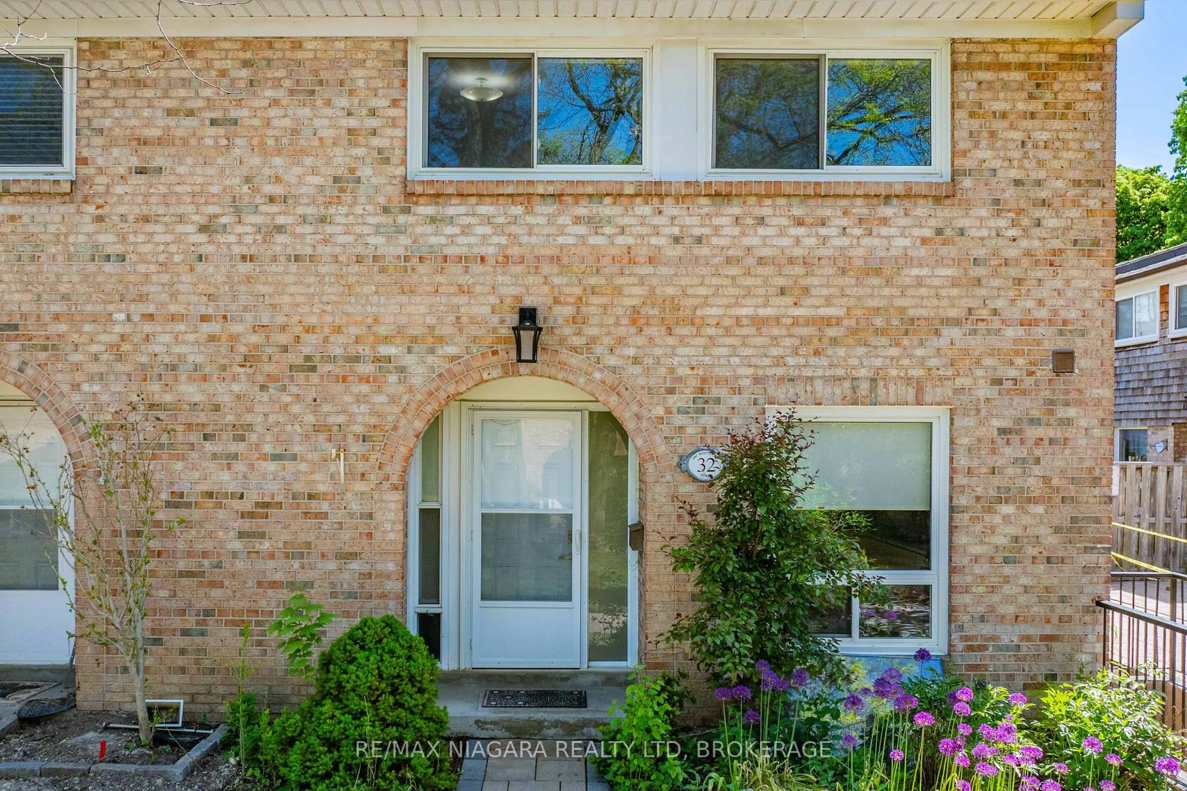 Home with brick exterior material, street for 1 Wootten Way #32, Markham Ontario L3P 3H7