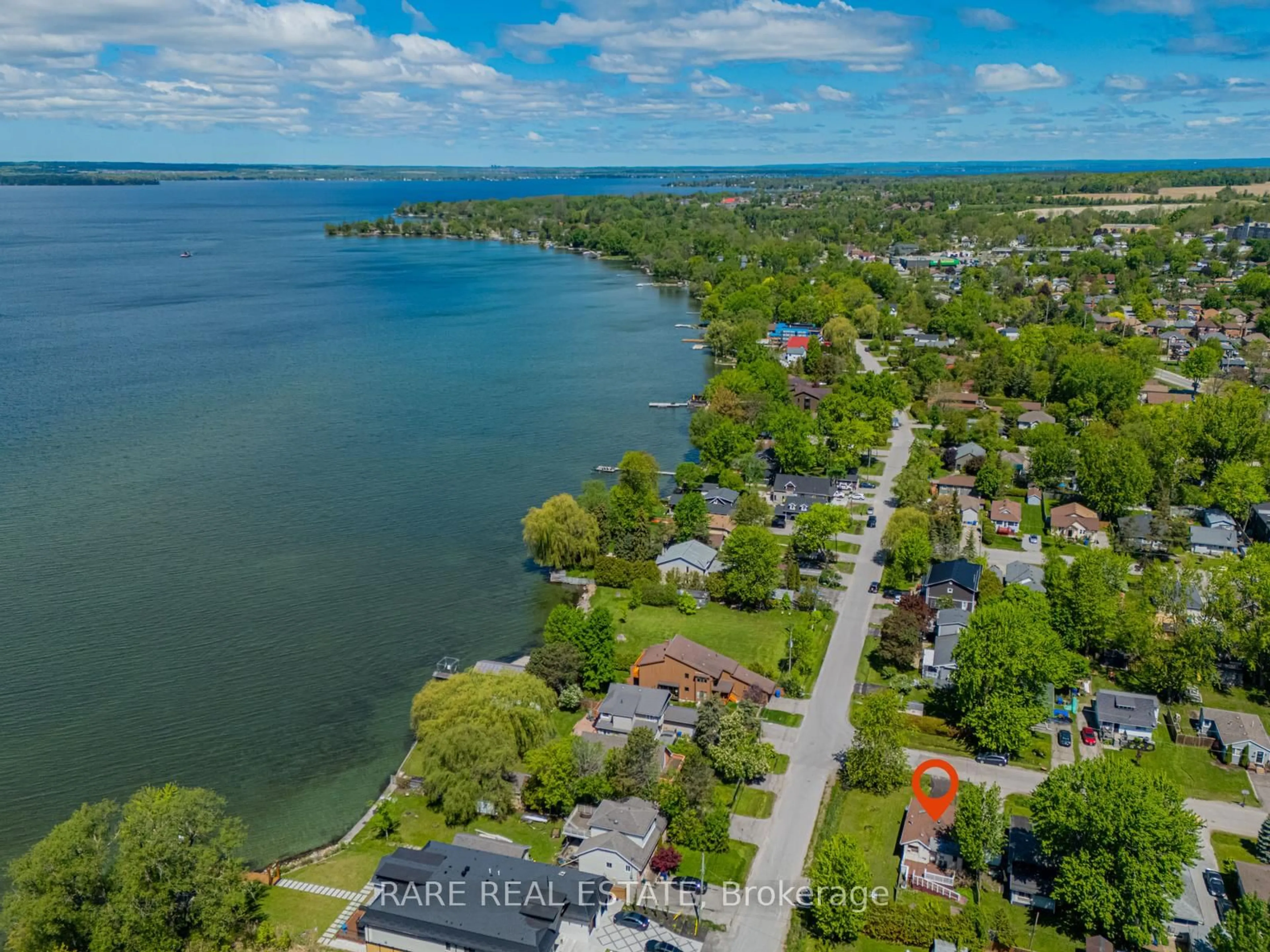 A pic from outside/outdoor area/front of a property/back of a property/a pic from drone, water/lake/river/ocean view for 205 Beach Rd, Georgina Ontario L4P 2L8
