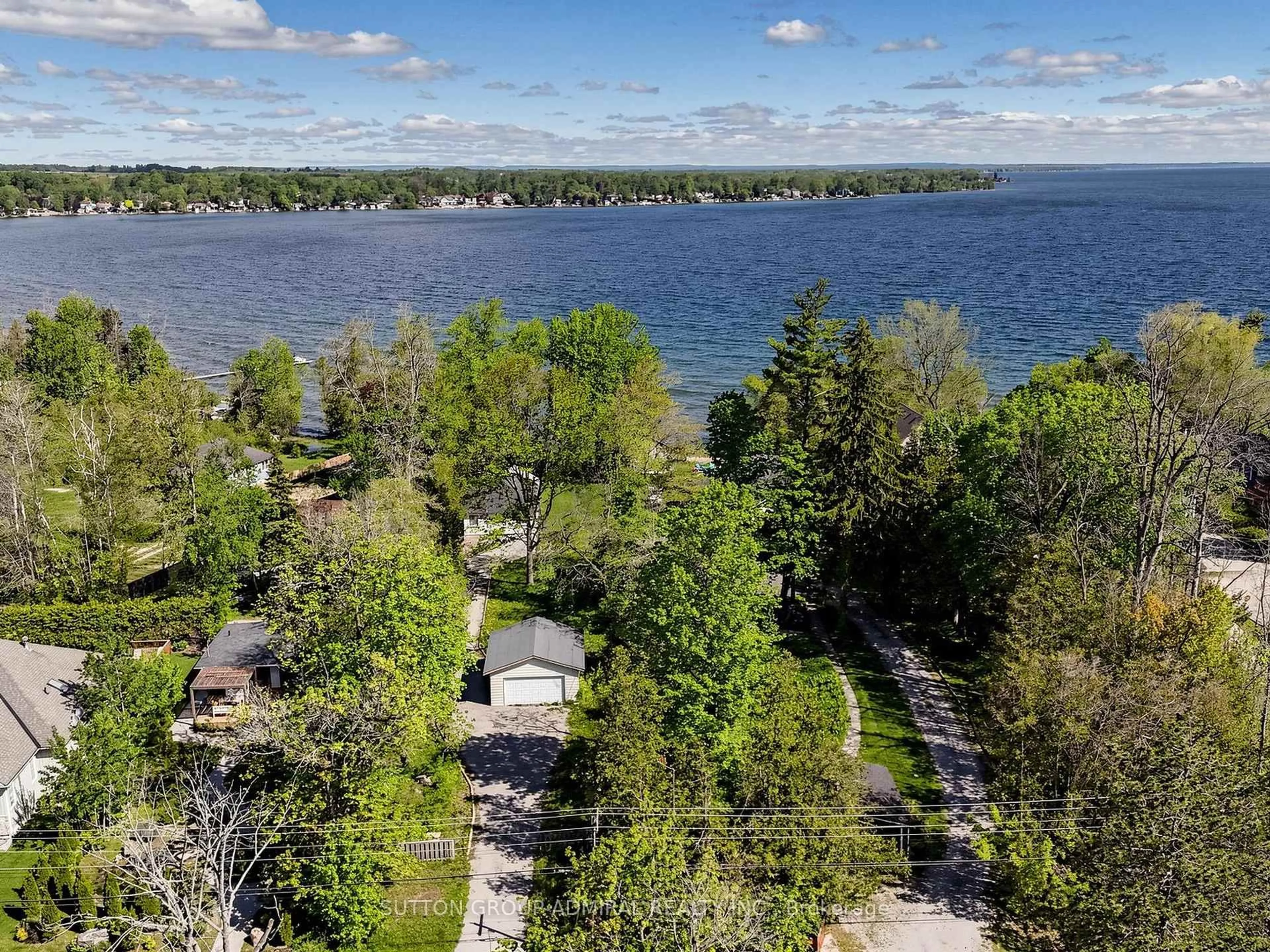 A pic from outside/outdoor area/front of a property/back of a property/a pic from drone, water/lake/river/ocean view for 770 Cedarvale Dr, Innisfil Ontario L9S 4L4