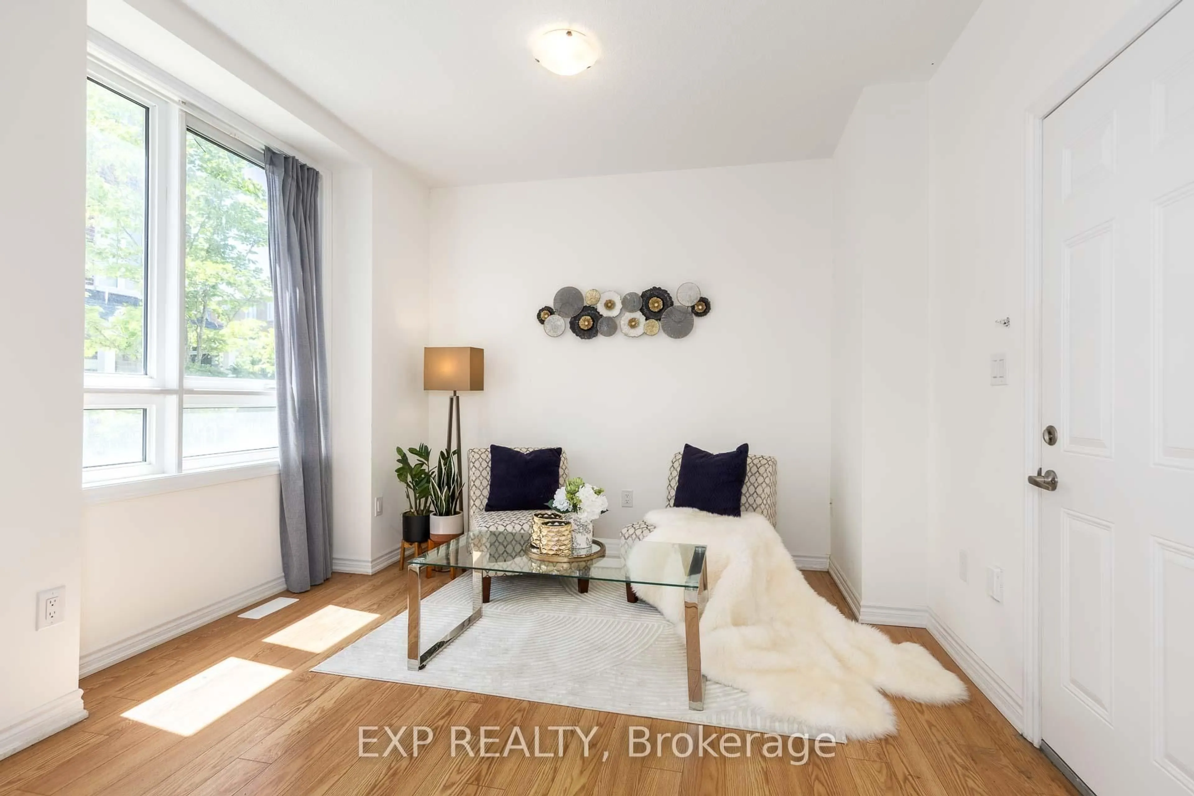 Living room with furniture, wood/laminate floor for 58 Massachusetts Lane, Markham Ontario L6E 2C1