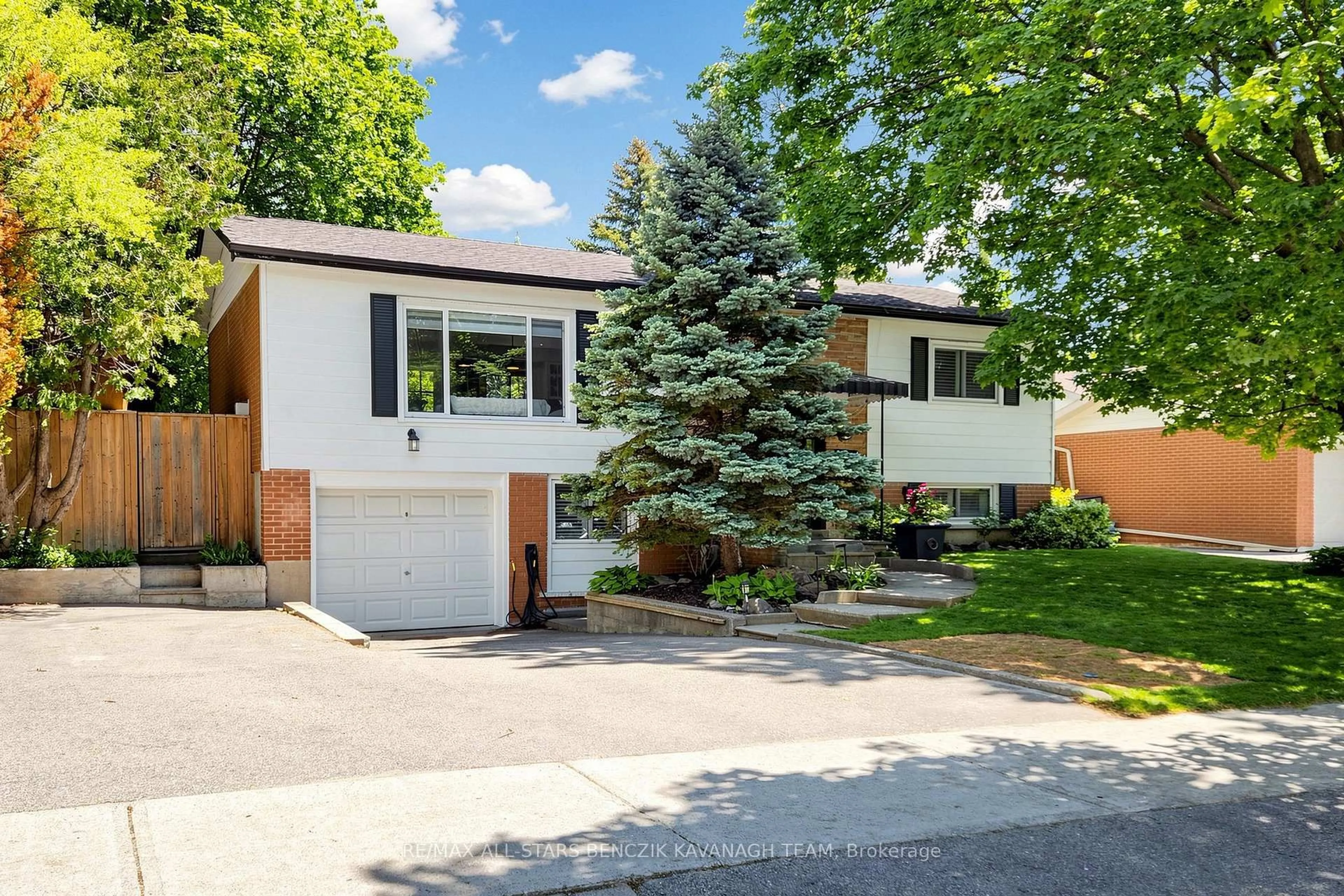Home with vinyl exterior material, street for 65 Wootten Way, Markham Ontario L3P 2Y5