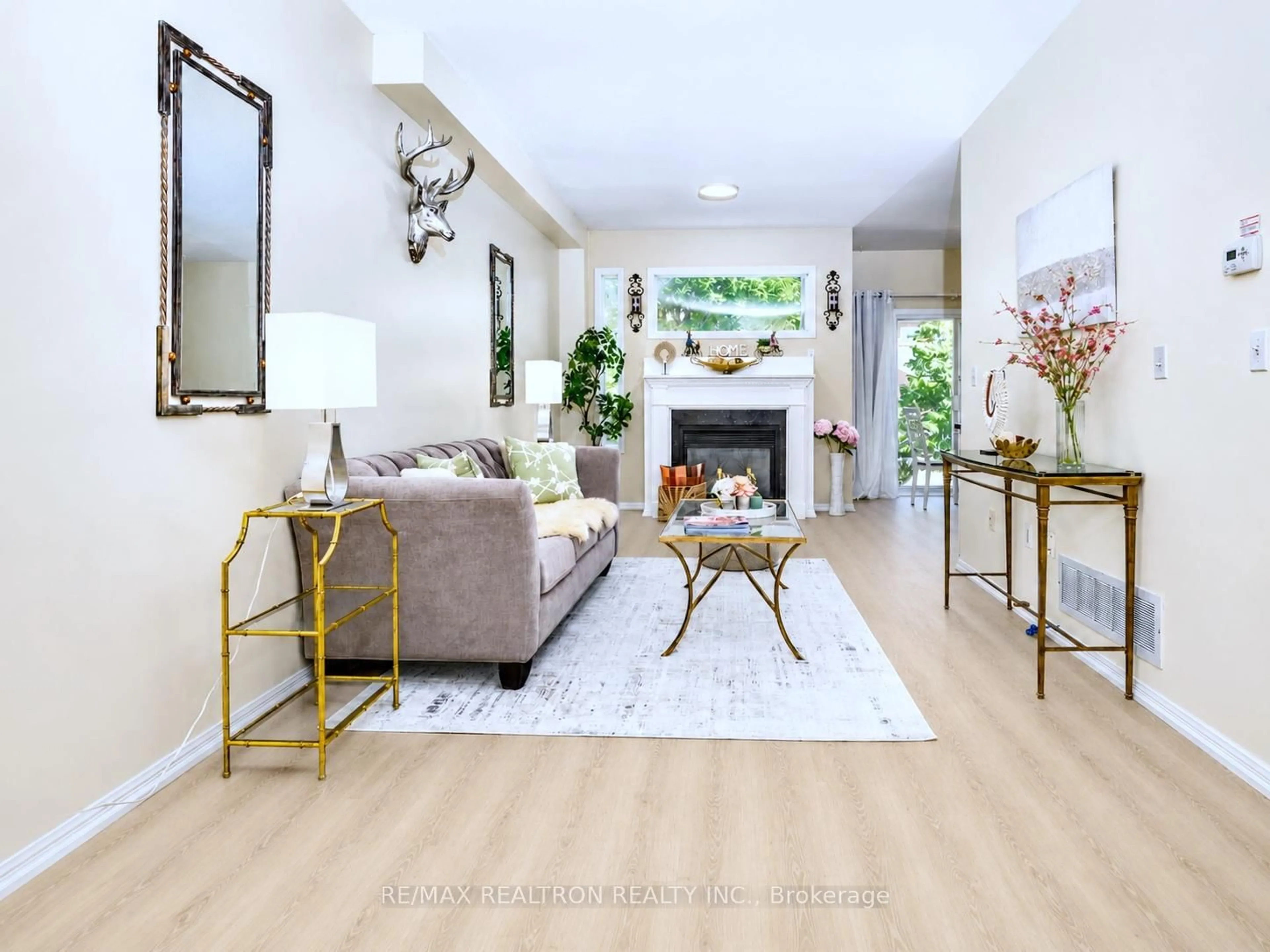 Living room with furniture, wood/laminate floor for 11 Zermatt Way, Markham Ontario L3R 5H9