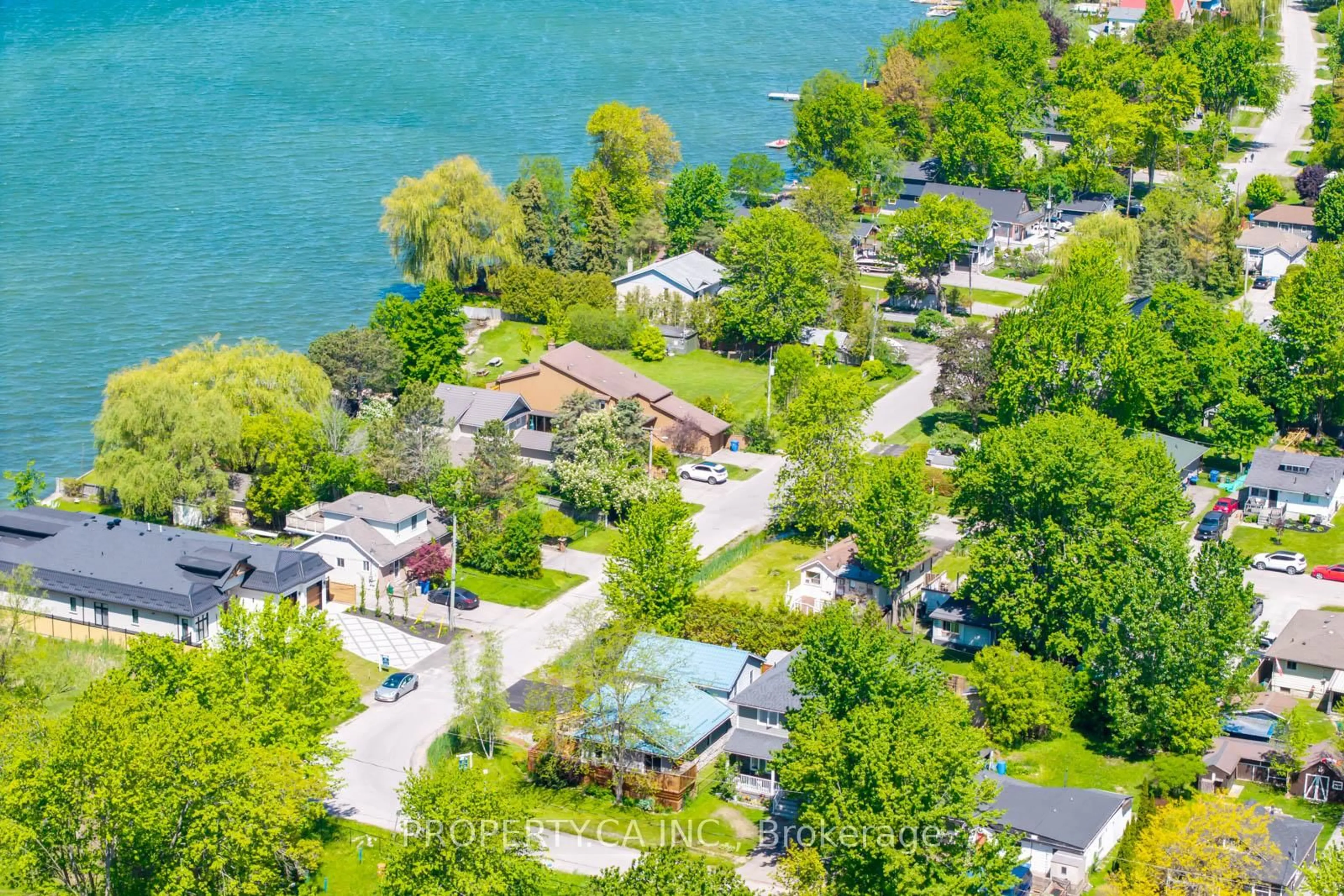 A pic from outside/outdoor area/front of a property/back of a property/a pic from drone, water/lake/river/ocean view for 131 Cook's Bay Dr, Georgina Ontario L4P 2M2