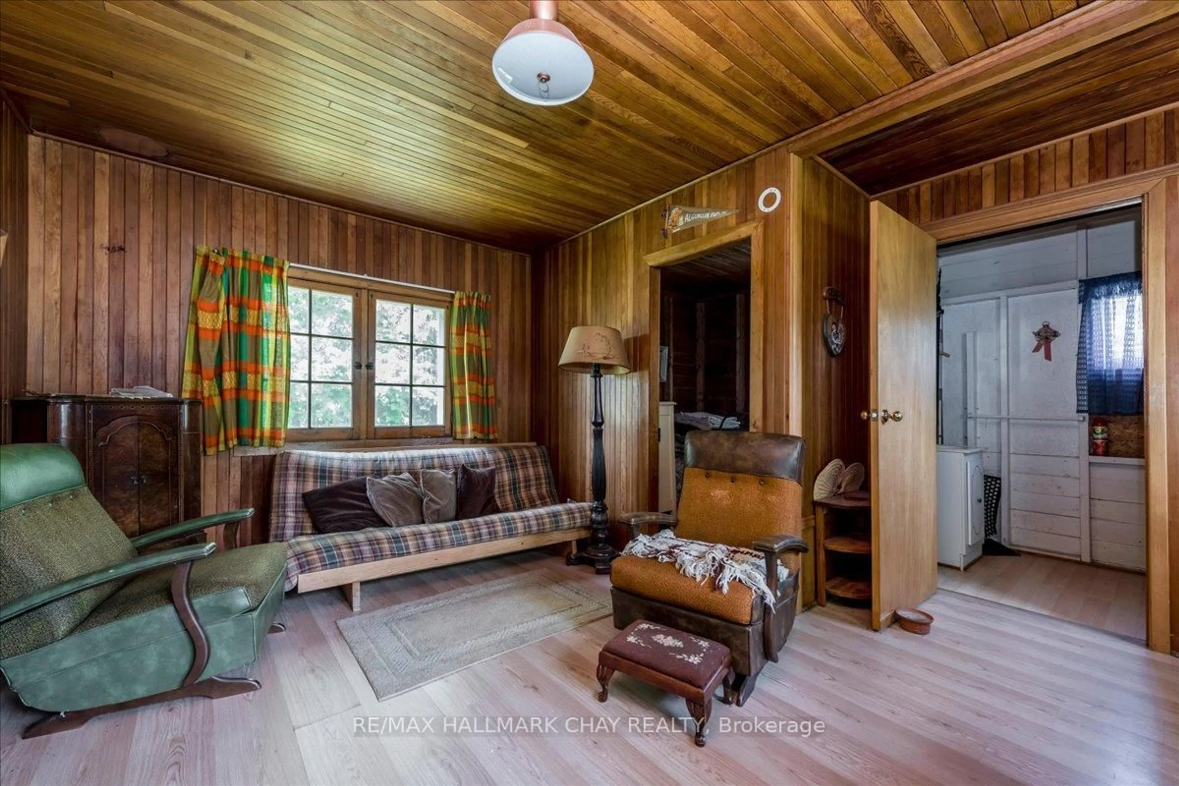 Living room with furniture, wood/laminate floor for 1056 Ewart St, Innisfil Ontario L0L 1C0