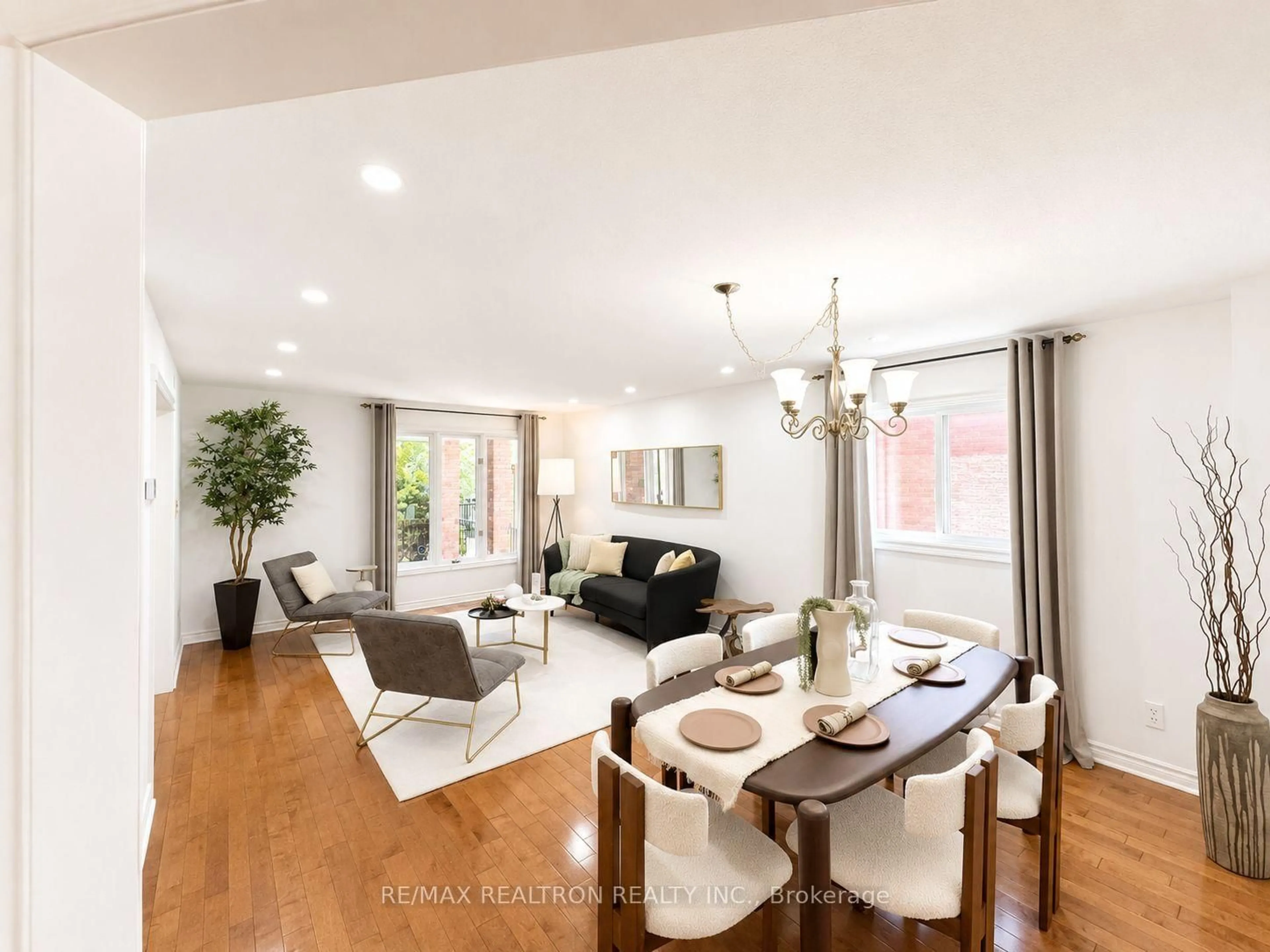 Living room with furniture, wood/laminate floor for 8 Muster Crt, Markham Ontario L3R 9G5