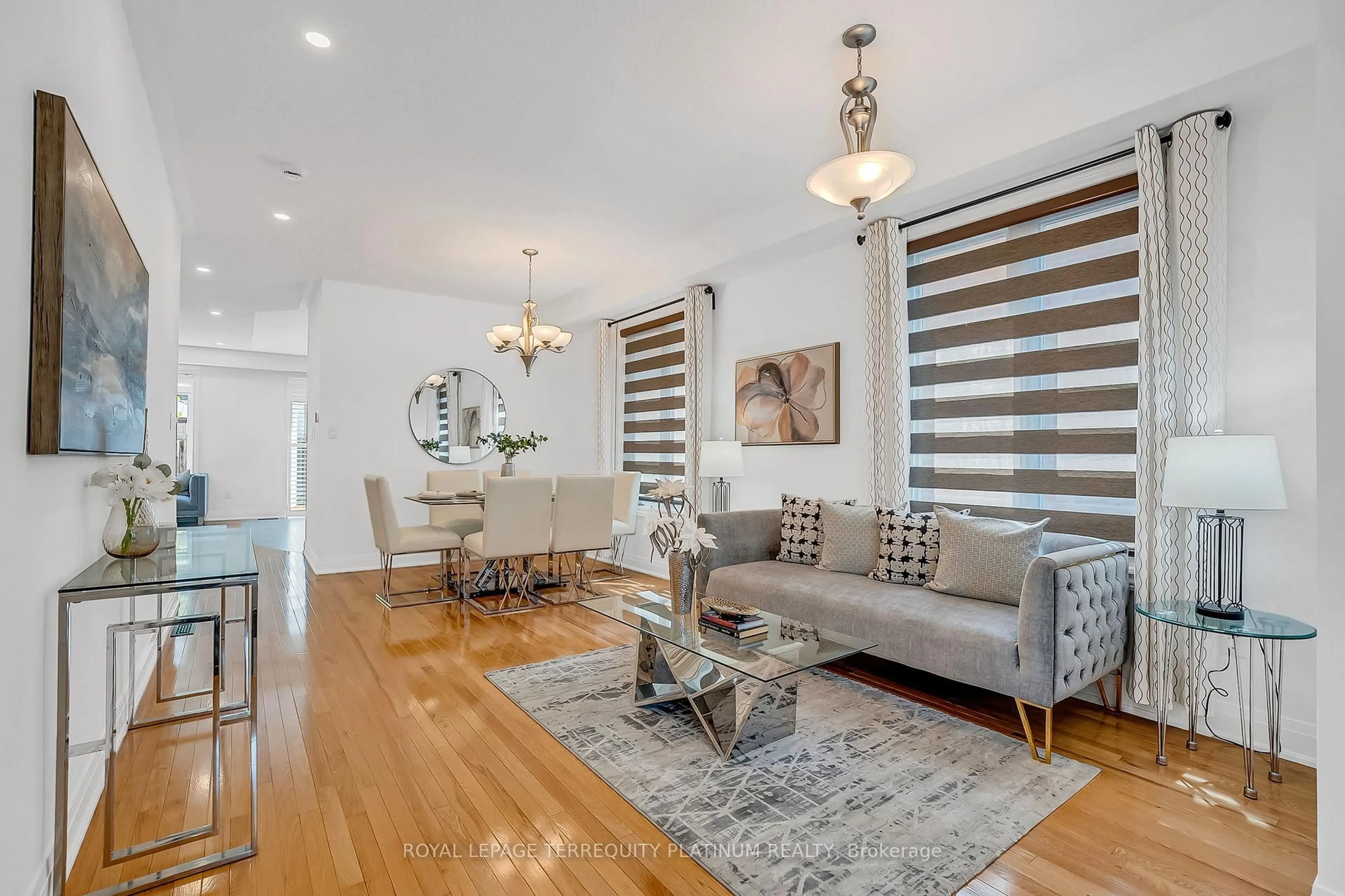 Living room with furniture, wood/laminate floor for 105 Alfred Paterson Dr, Markham Ontario L6E 1L5
