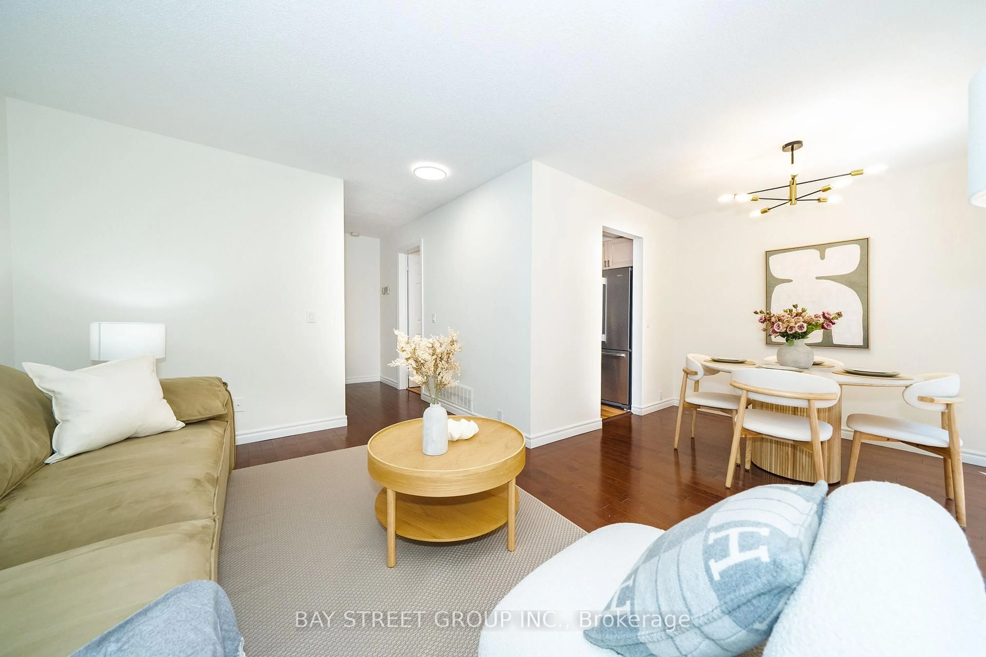 Living room with furniture, wood/laminate floor for 27 Vanessa Rd, Markham Ontario L3R 4W1