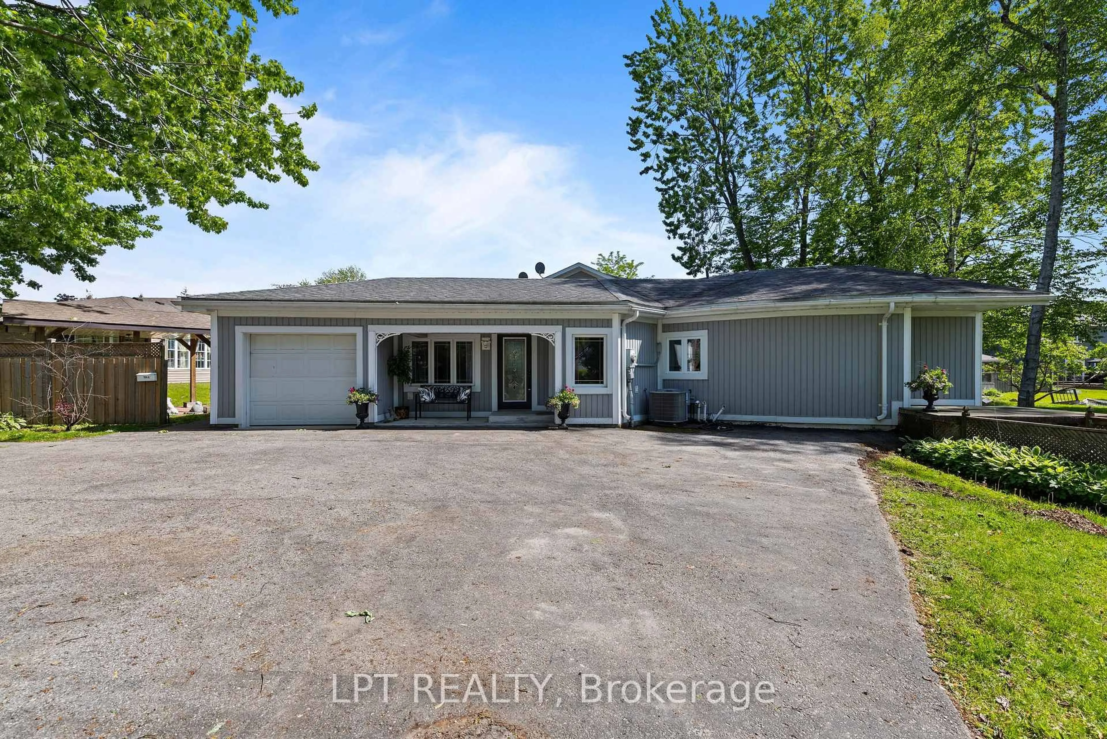A pic from outside/outdoor area/front of a property/back of a property/a pic from drone, street for 204 The Queensway, Georgina Ontario L4P 2A6