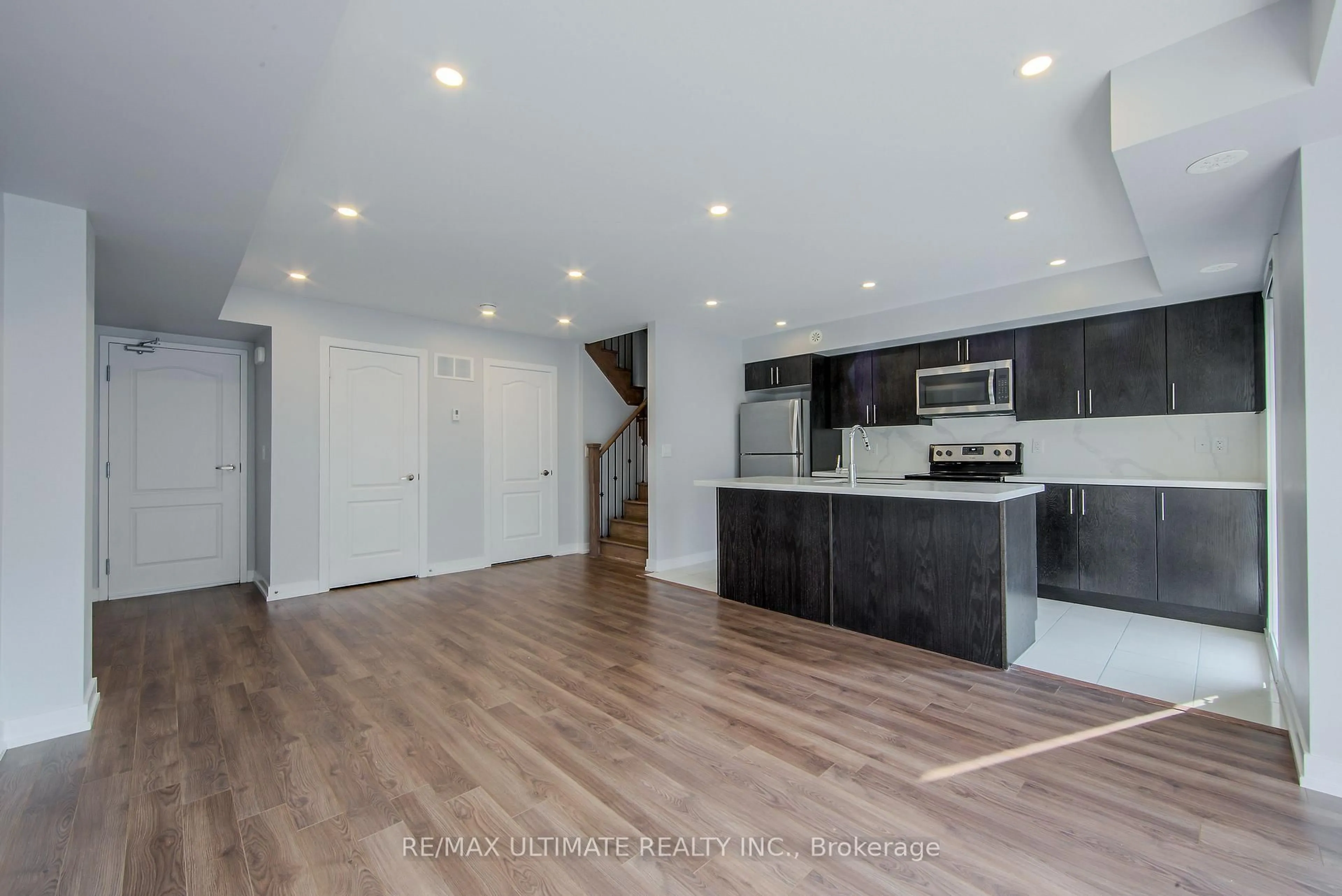 Open concept kitchen, wood/laminate floor for 30 Dunsheath Way #512, Markham Ontario L6B 1N3