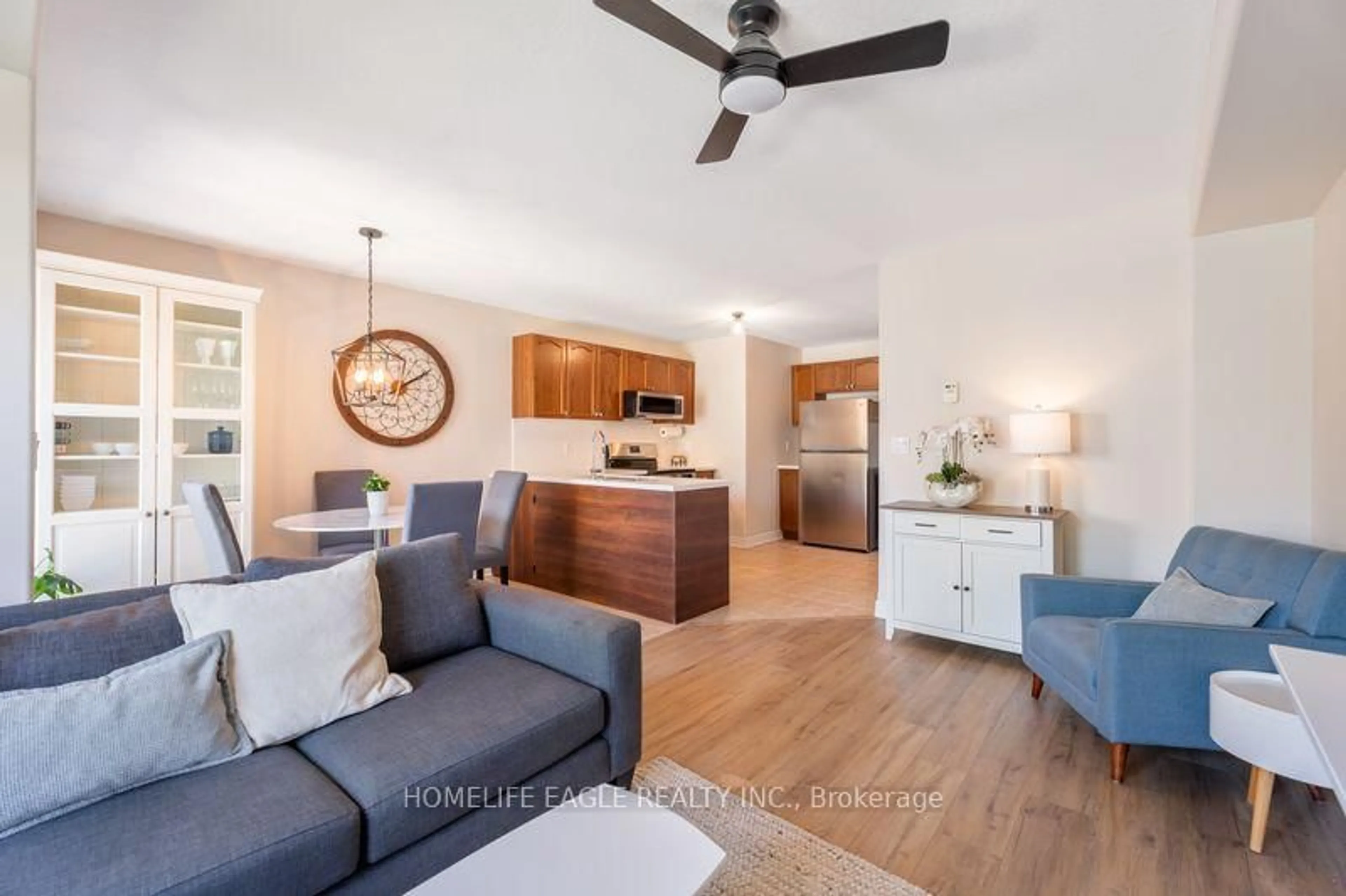Living room with furniture, wood/laminate floor for 1787 Lamstone St, Innisfil Ontario L9S 4Z9