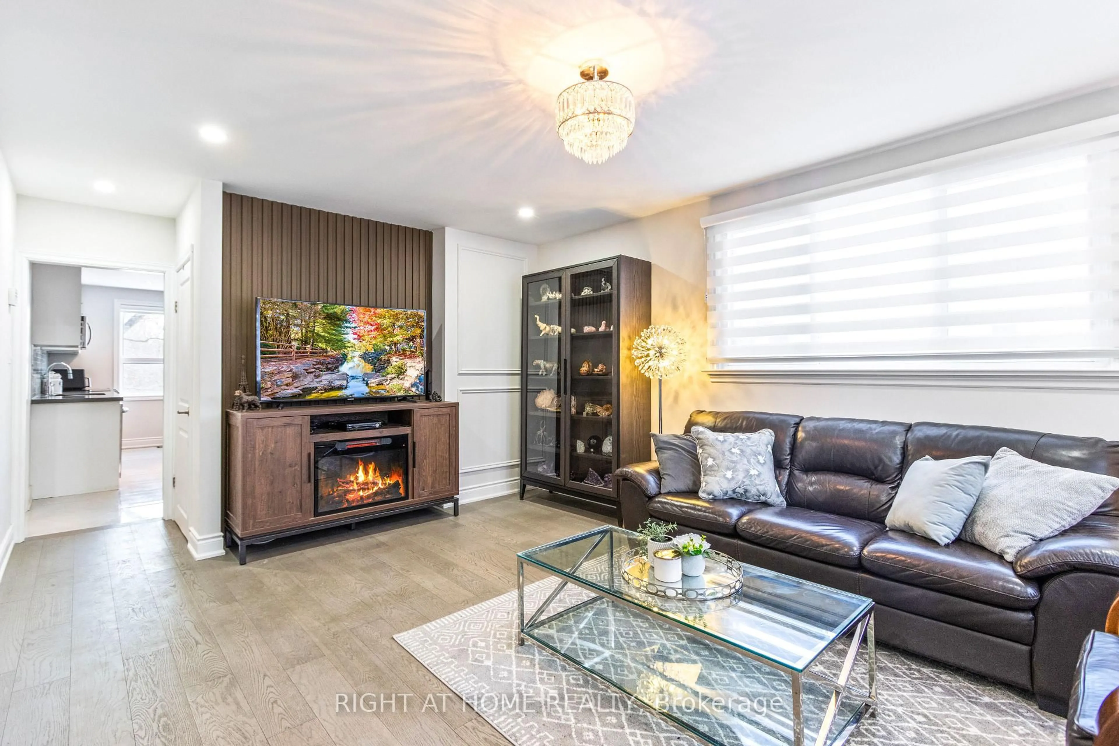 Living room with furniture, wood/laminate floor for 735 Srigley St, Newmarket Ontario L3Y 1X6