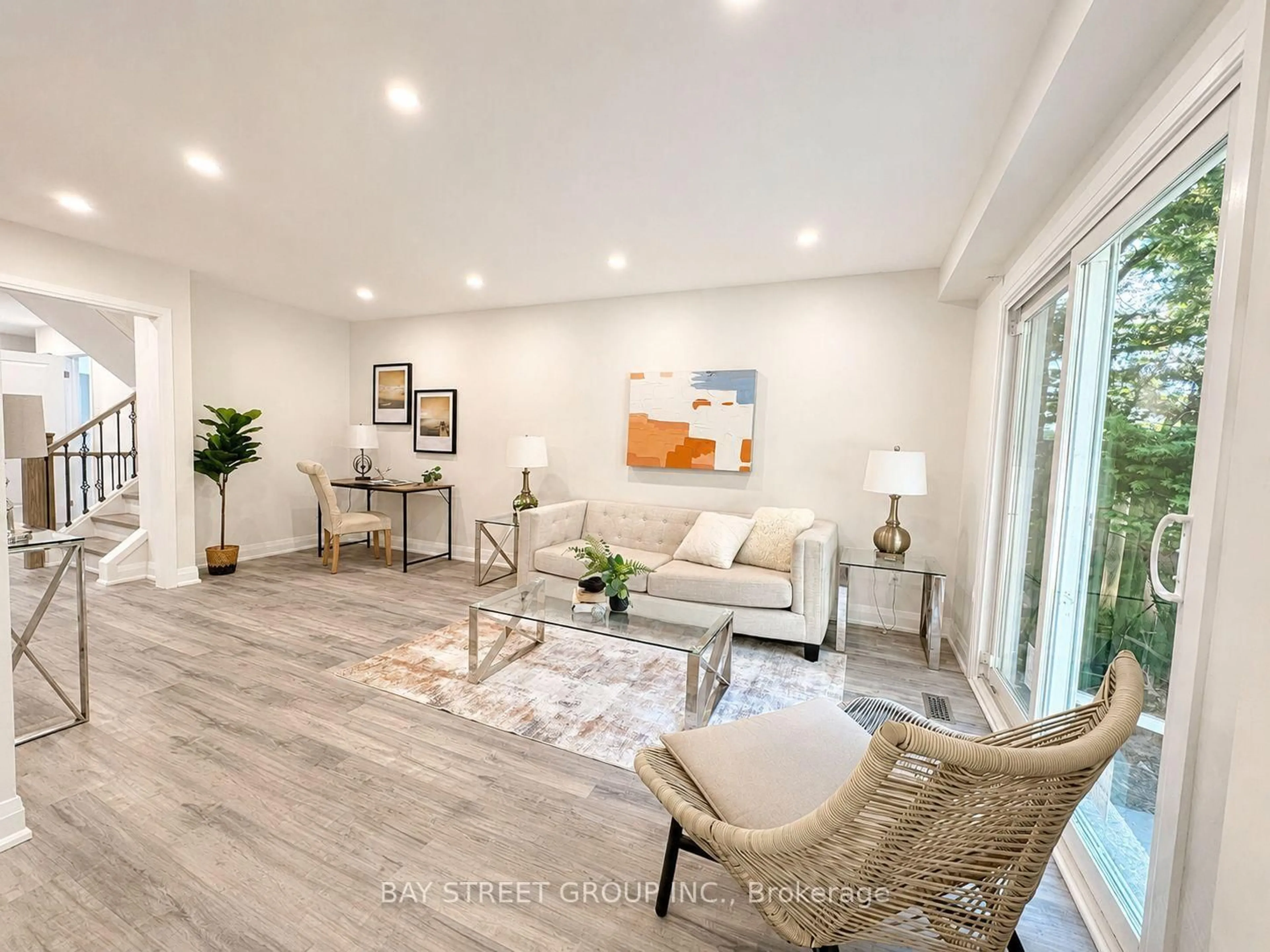 Living room with furniture, wood/laminate floor for 44 Lilac Ave, Markham Ontario L3T 5K2