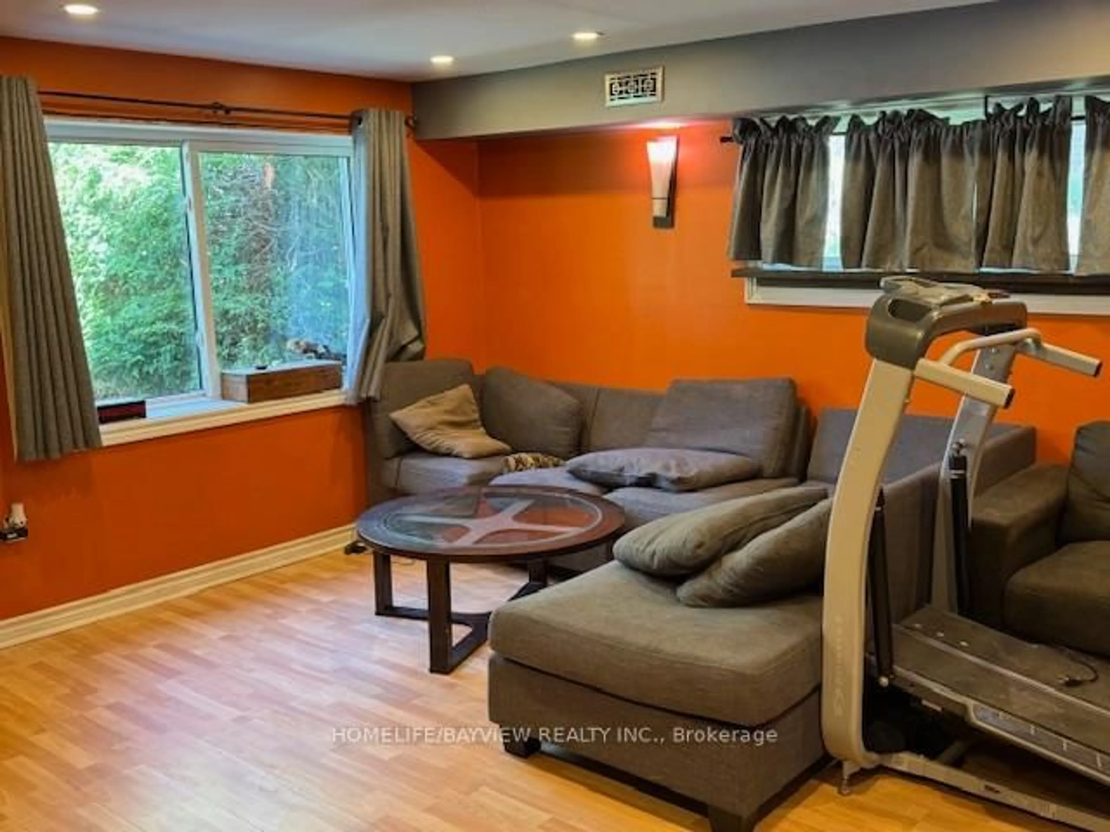 Living room with furniture, wood/laminate floor for 34 River Dr, Essa Ontario L0M 1B0