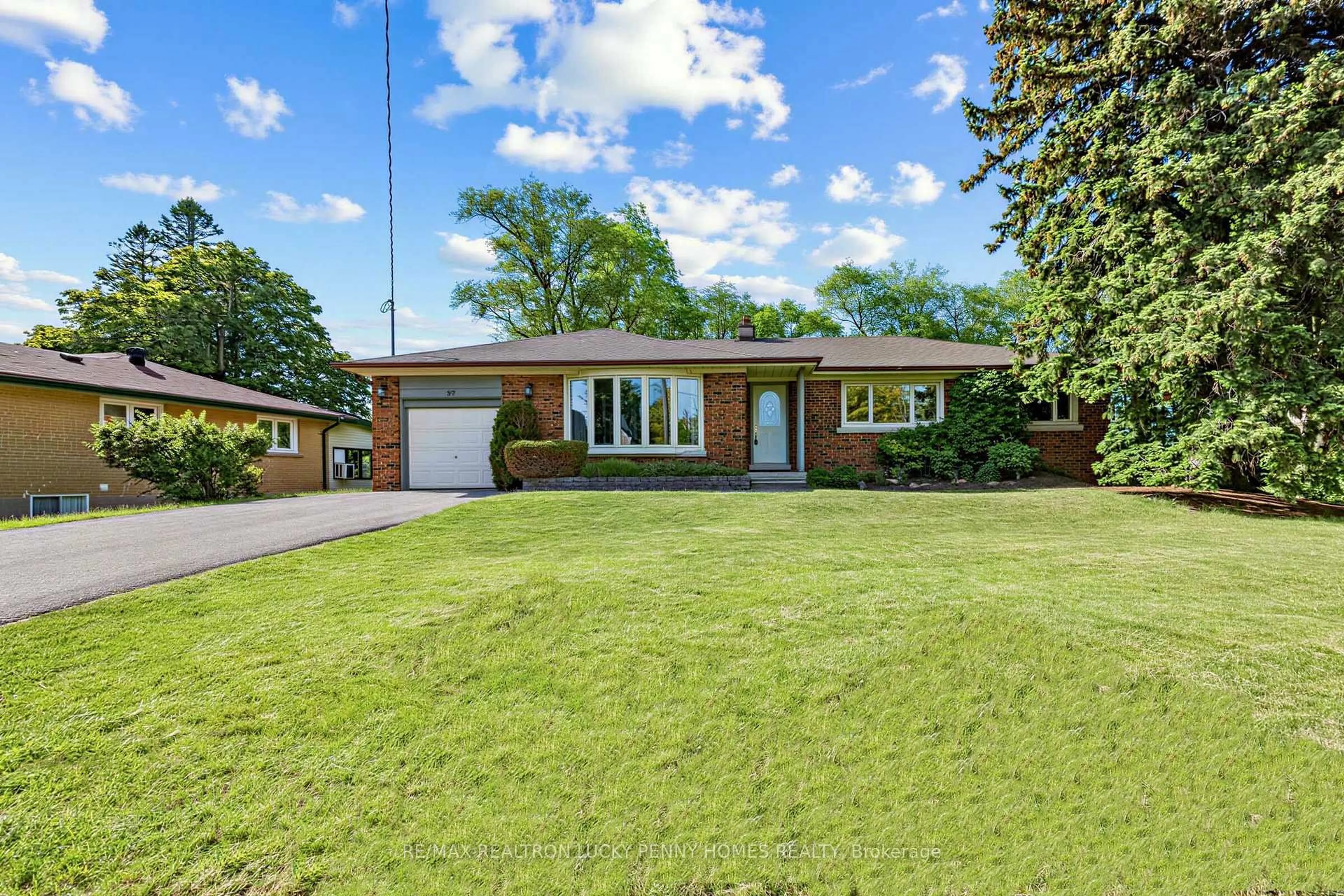 Home with brick exterior material, street for 57 Windridge Dr, Markham Ontario L3P 1T9