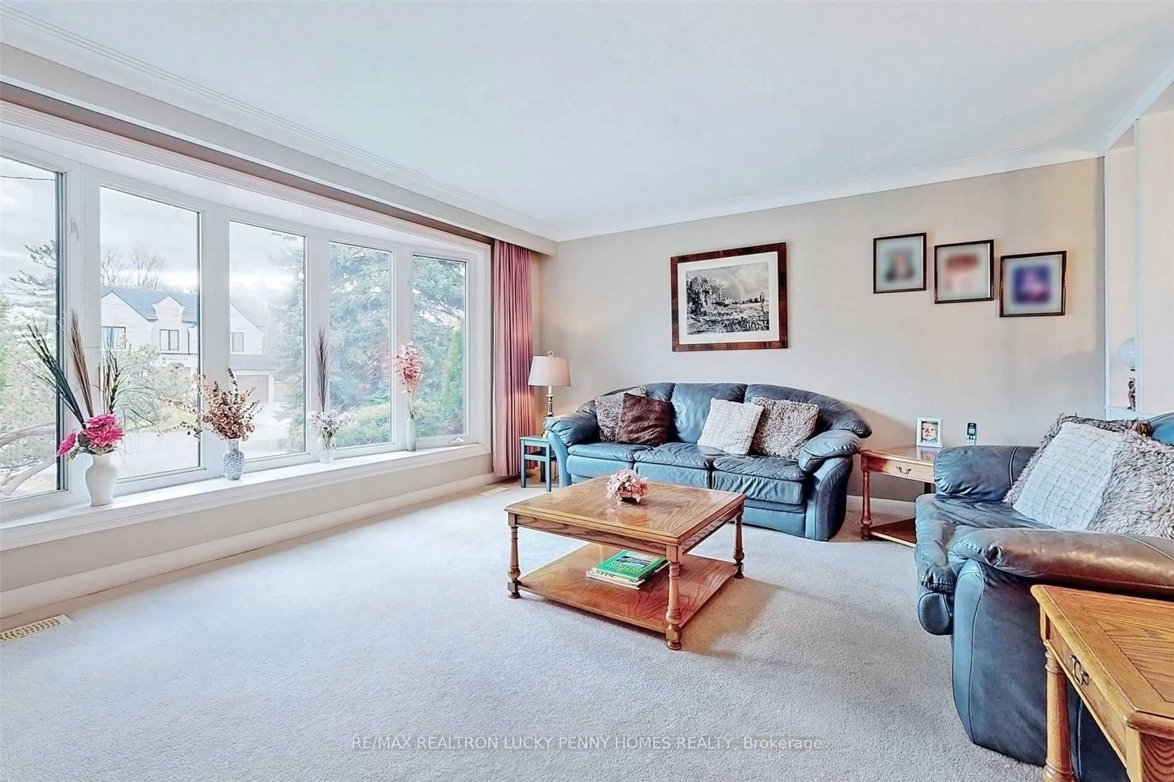Living room with furniture, unknown for 57 Windridge Dr, Markham Ontario L3P 1T9