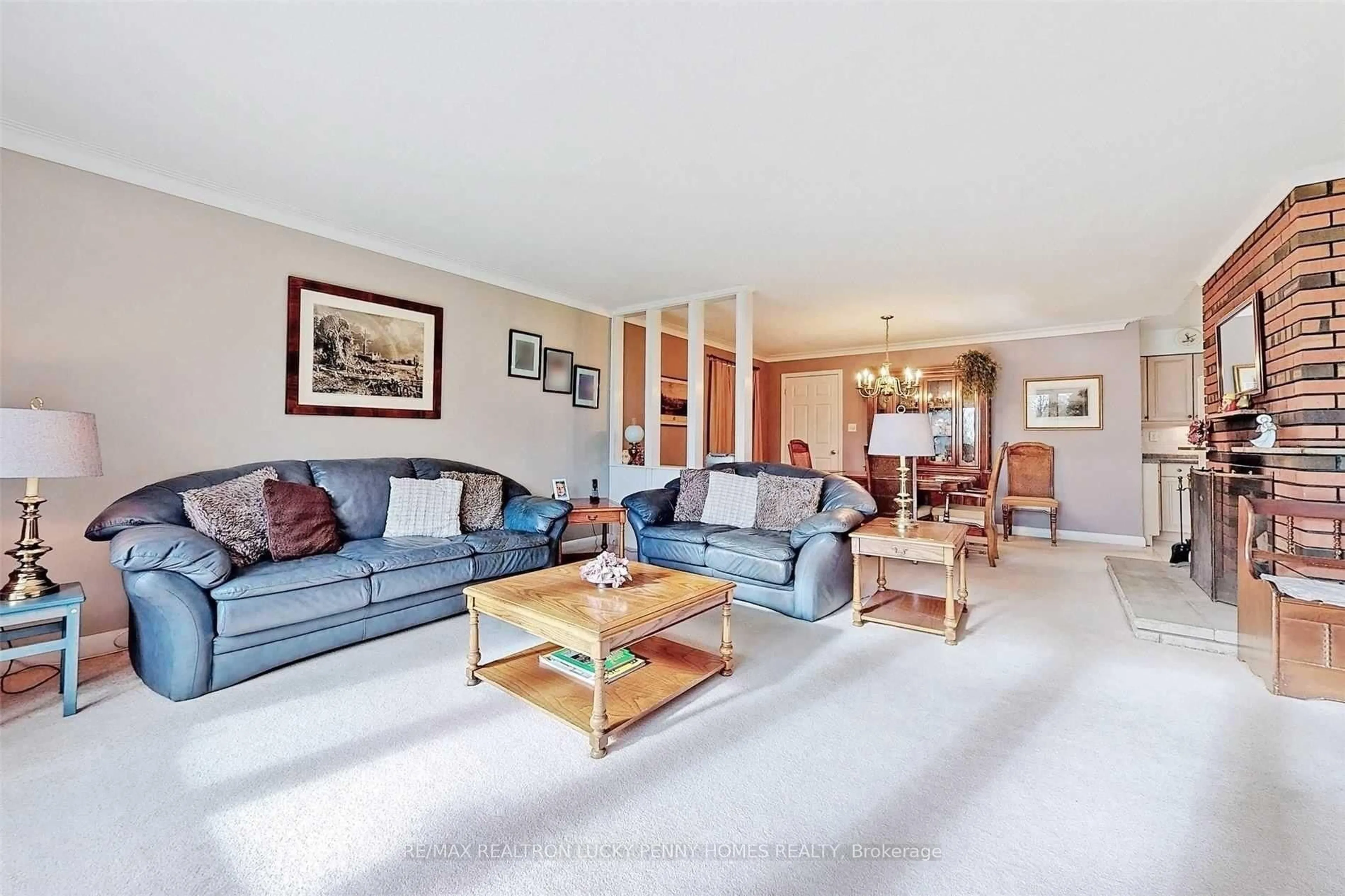 Living room with furniture, unknown for 57 Windridge Dr, Markham Ontario L3P 1T9