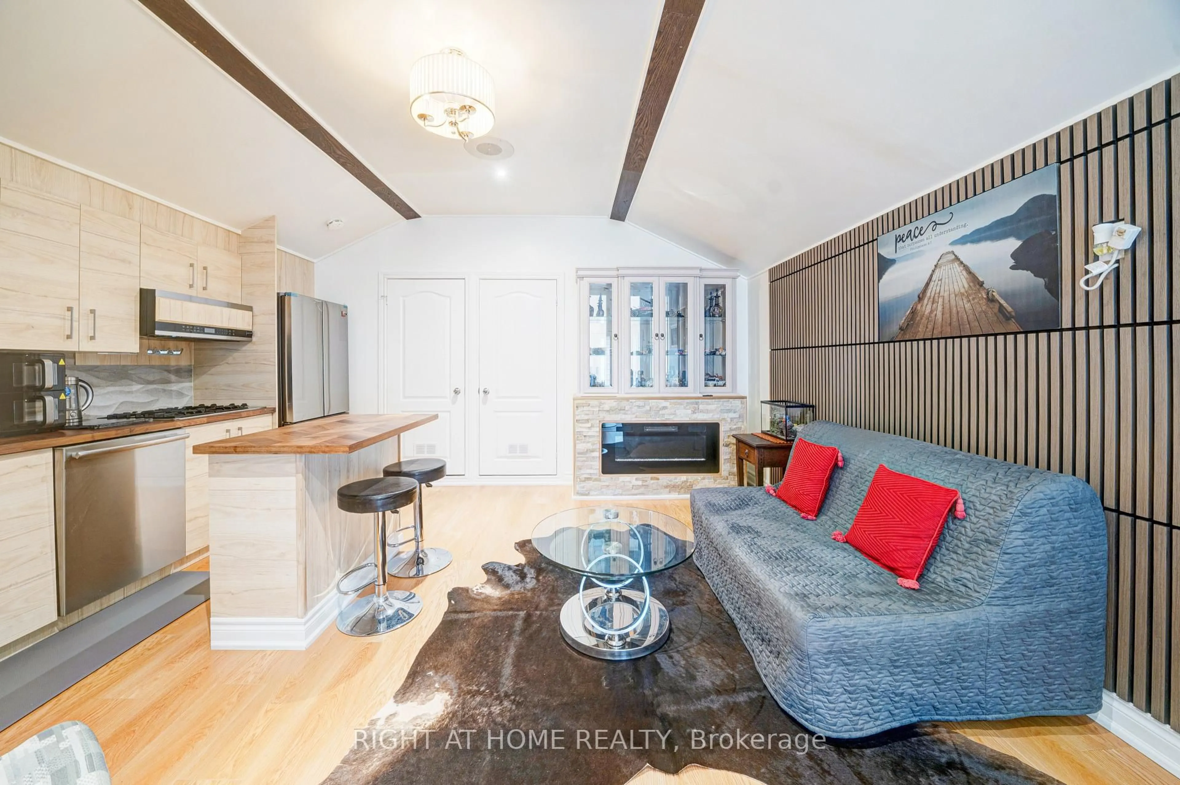 Living room with furniture, wood/laminate floor for 2020 Kate Ave, Innisfil Ontario L9S 1Y2