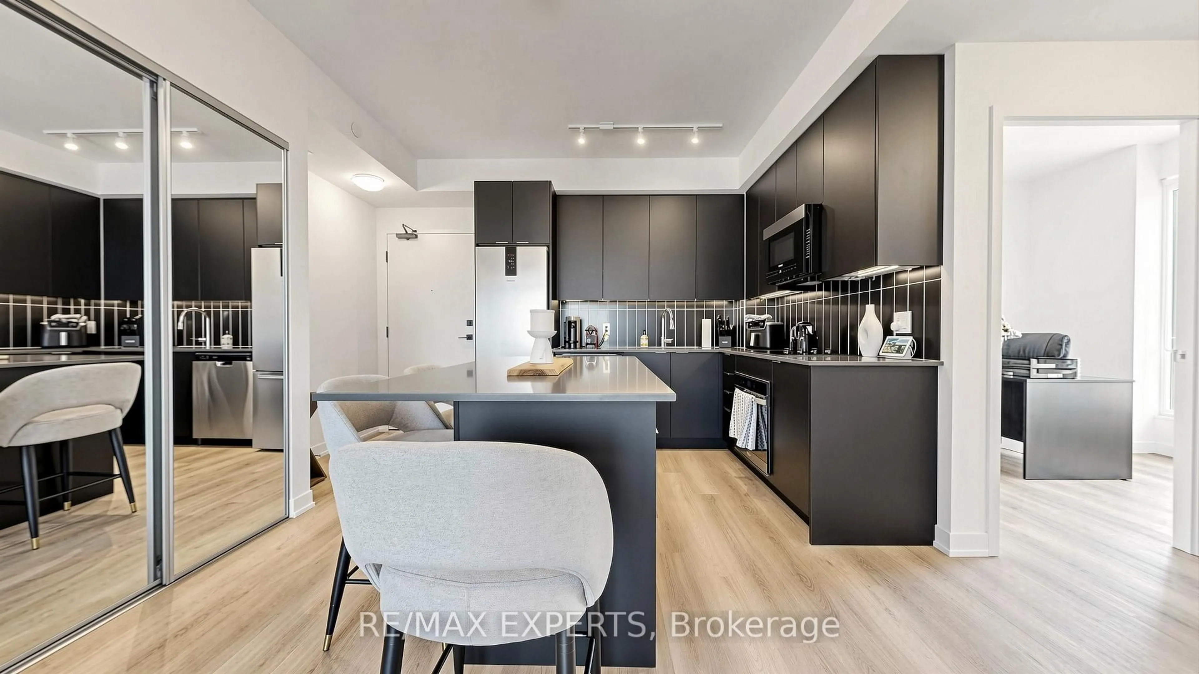 Open concept kitchen, wood/laminate floor for 498 Caldari Rd #618, Vaughan Ontario L4K 0R6