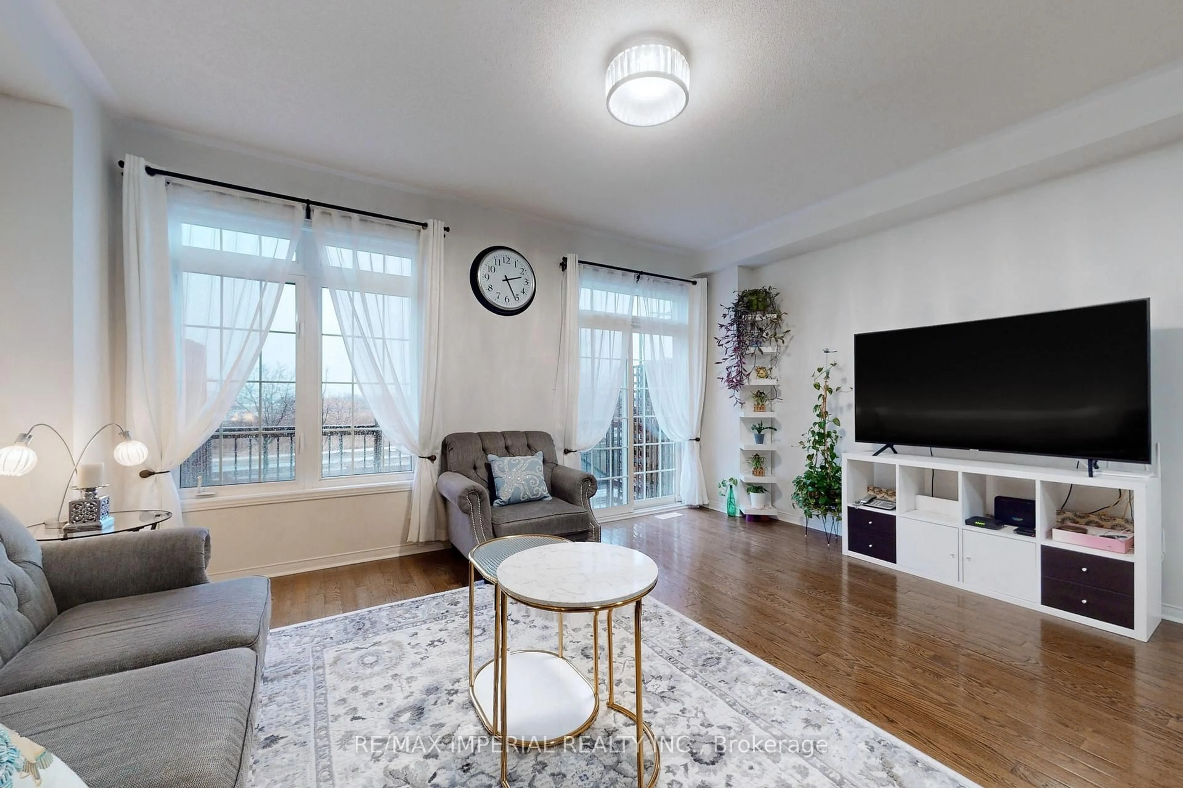 Living room with furniture, wood/laminate floor for 28 Spruce Pine Cres, Vaughan Ontario L6A 4T3