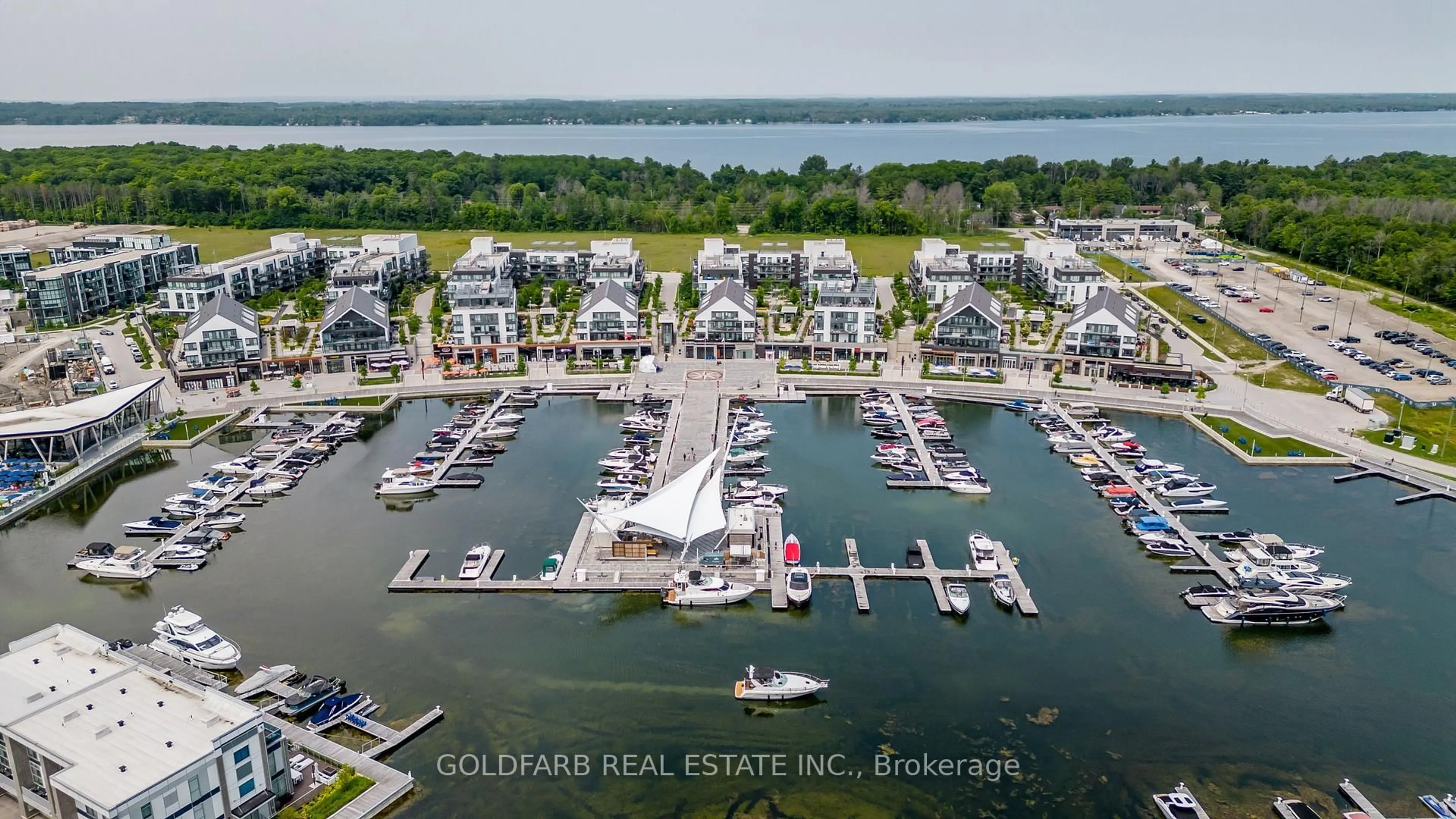 A pic from outside/outdoor area/front of a property/back of a property/a pic from drone, water/lake/river/ocean view for 333 Sea Ray Ave #D322, Innisfil Ontario L9S 0M3