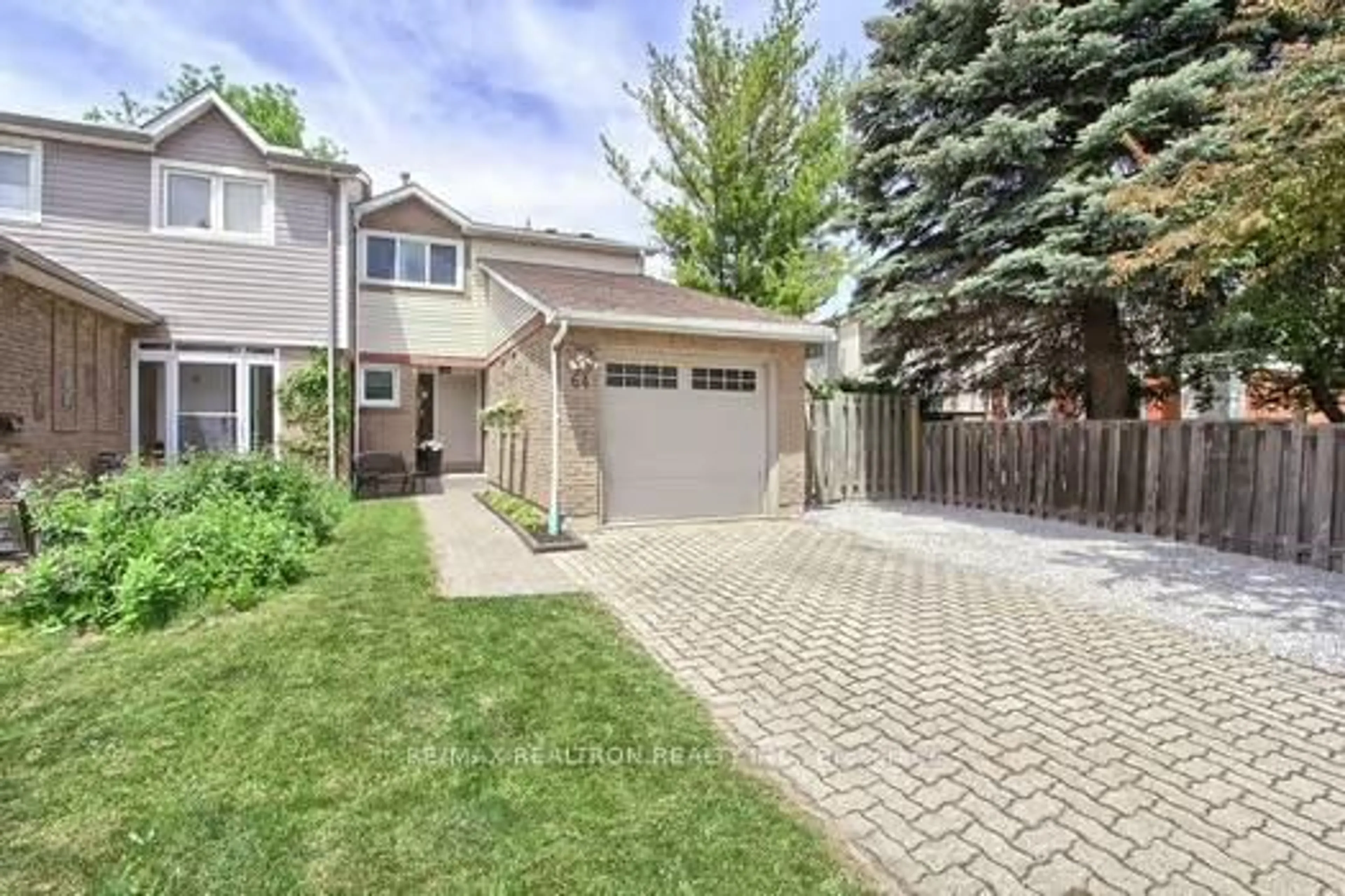 Home with brick exterior material, street for 64 Durie Lane, Markham Ontario L3T 5H5
