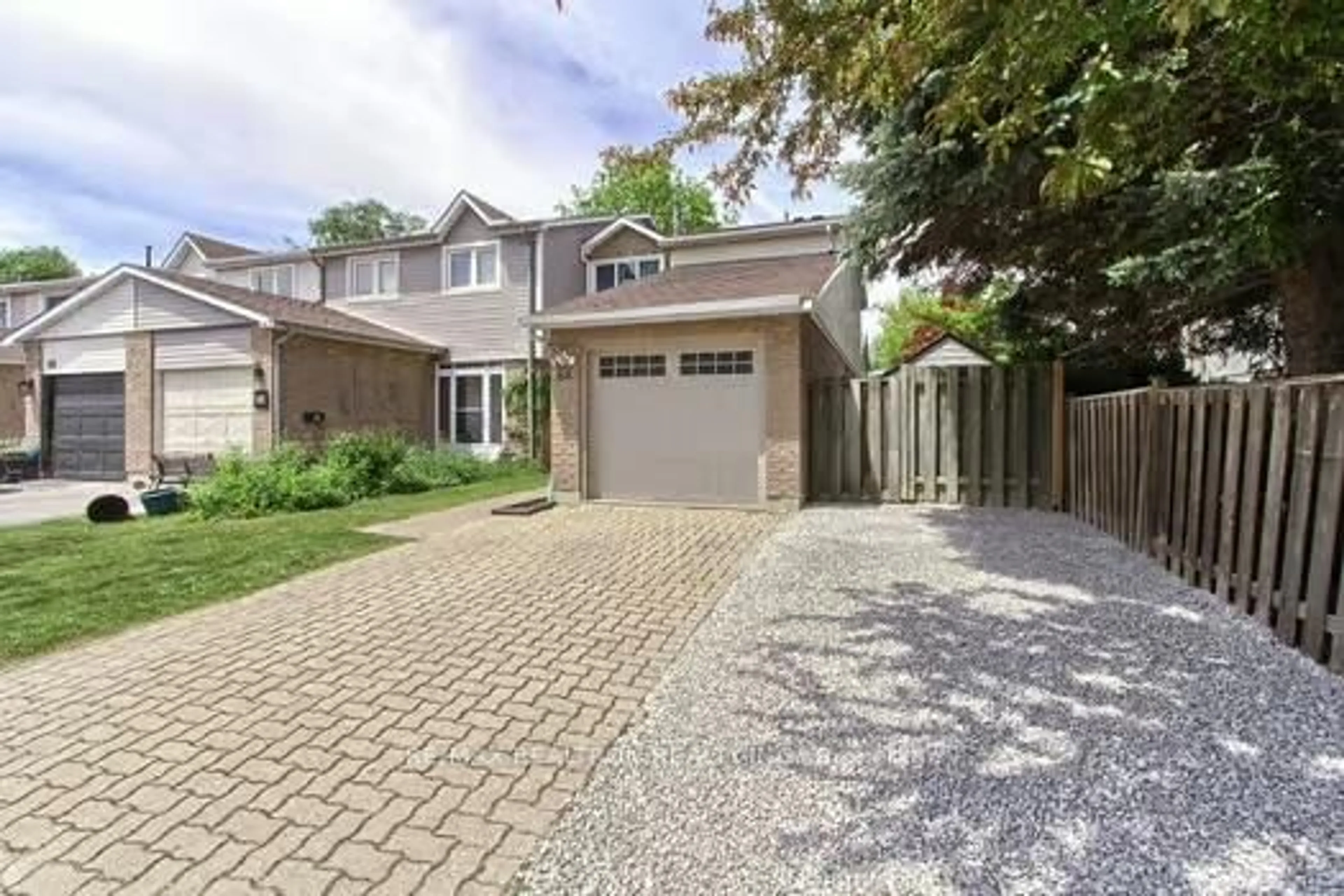 Home with brick exterior material, street for 64 Durie Lane, Markham Ontario L3T 5H5