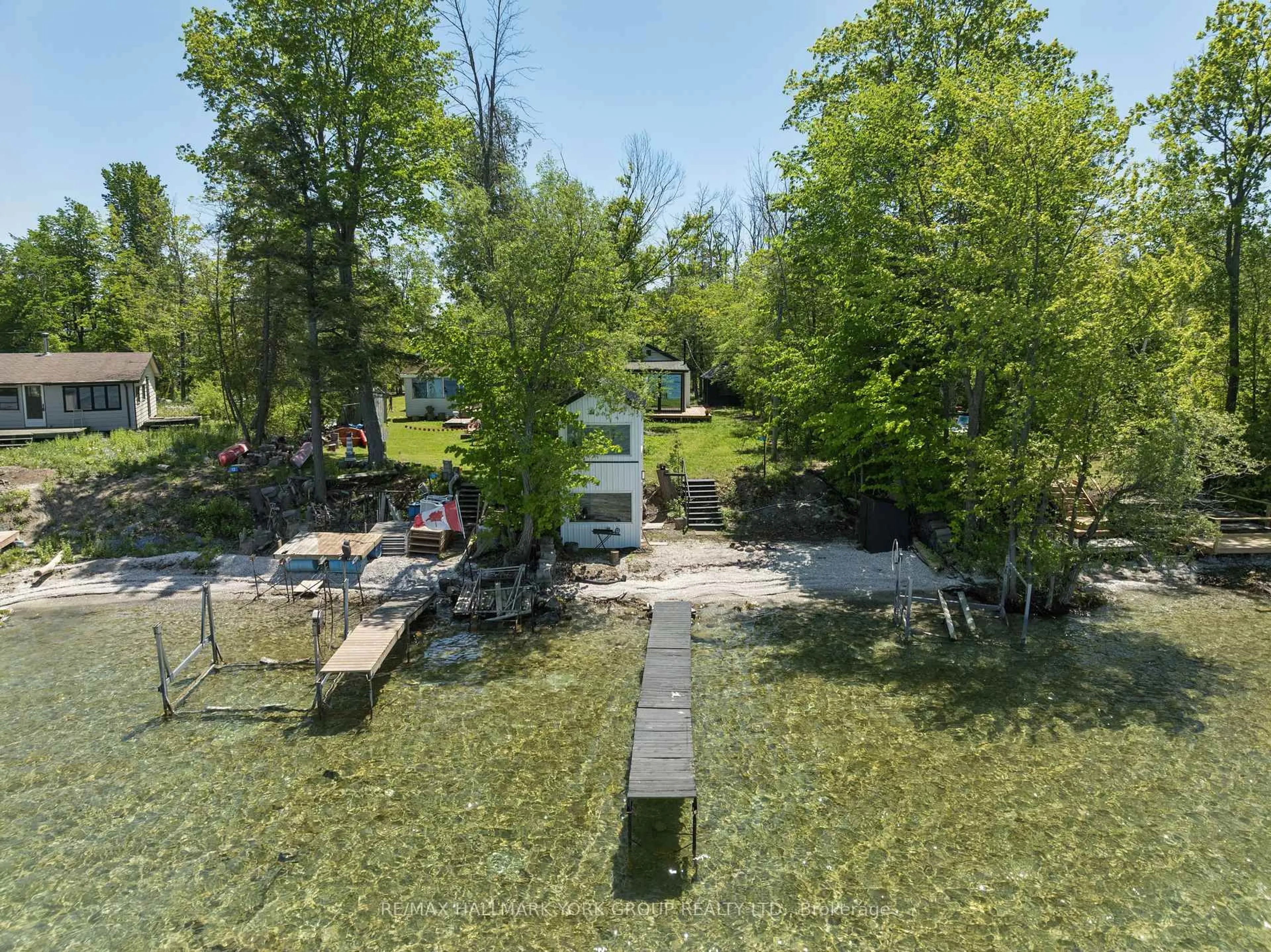 A pic from outside/outdoor area/front of a property/back of a property/a pic from drone, water/lake/river/ocean view for 10 Snake Island Rd, Georgina Islands Ontario L4P 3E9