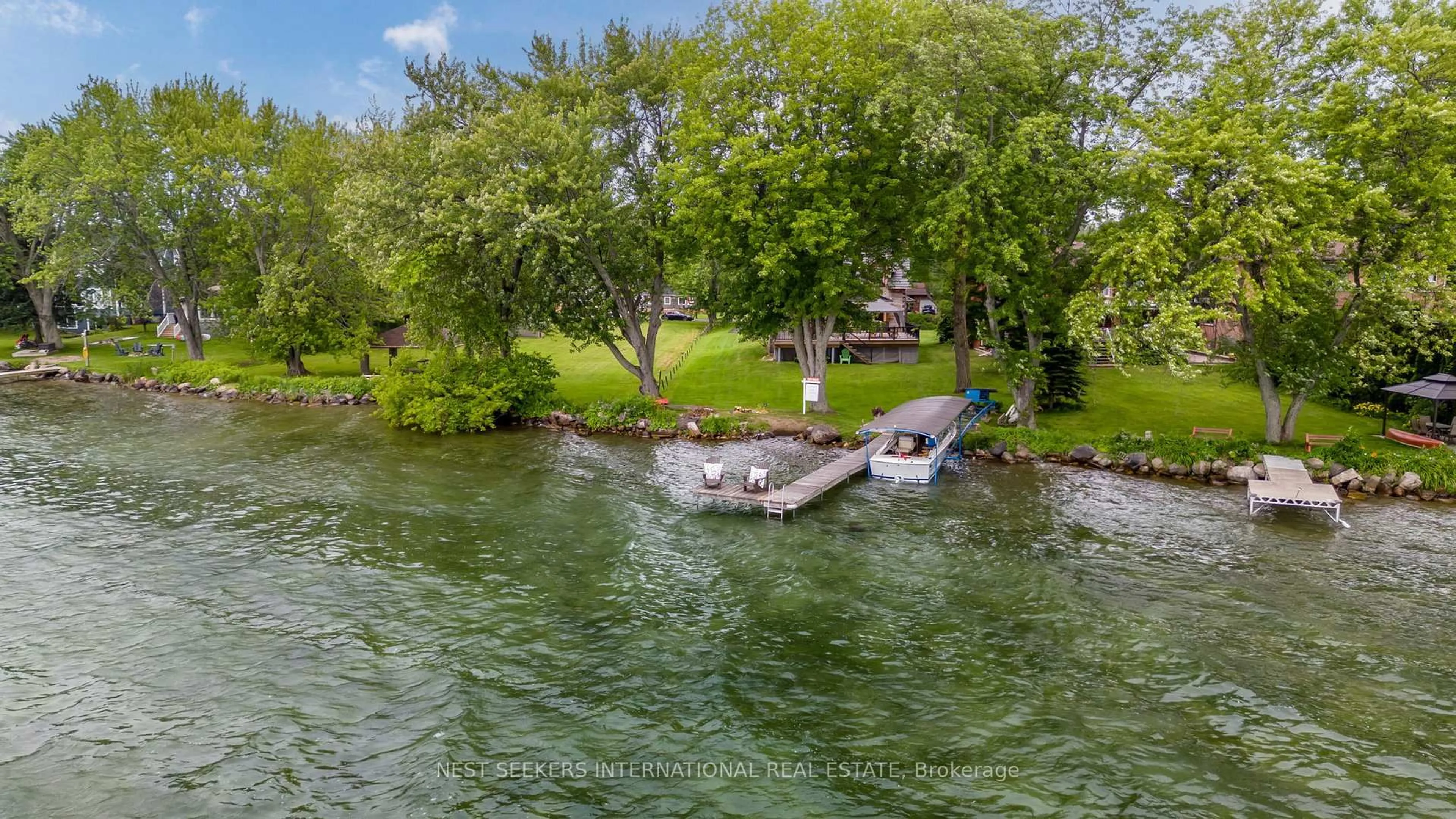 A pic from outside/outdoor area/front of a property/back of a property/a pic from drone, water/lake/river/ocean view for 219 Bayshore Rd, Innisfil Ontario L0L 1K0