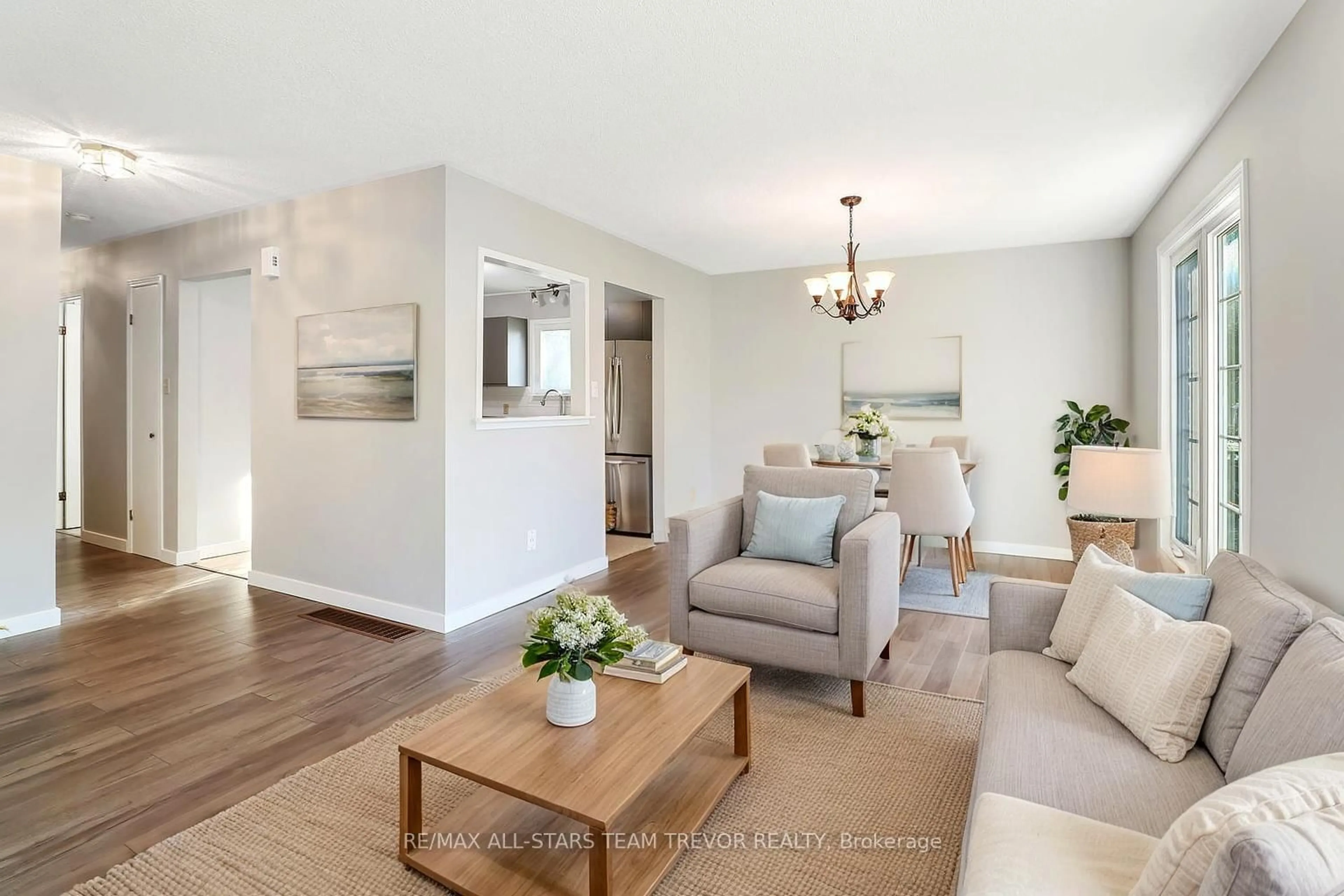 Living room with furniture, wood/laminate floor for 161 Silas Blvd, Georgina Ontario L4P 2K2