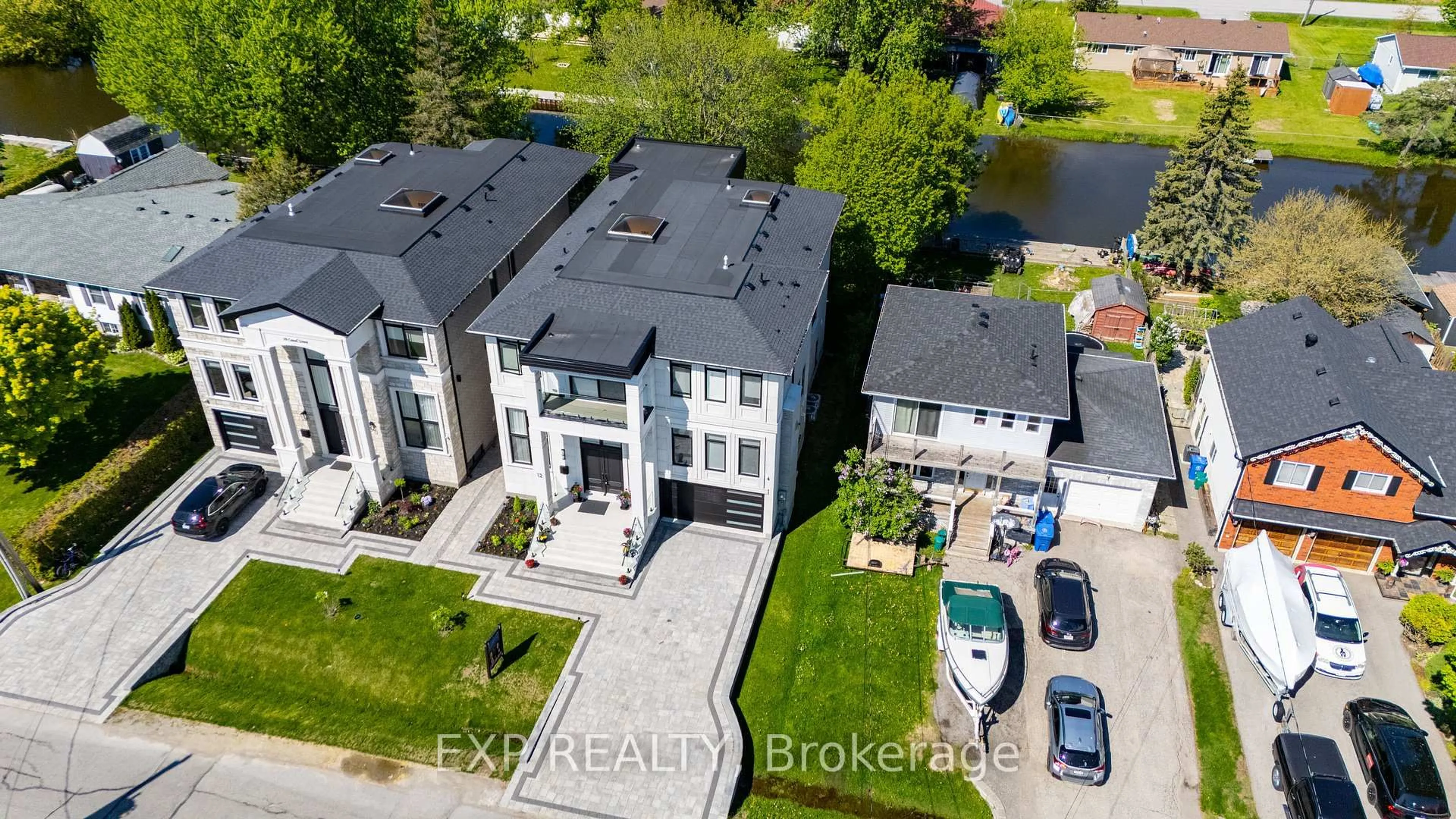 A pic from outside/outdoor area/front of a property/back of a property/a pic from drone, street for 12 Canal St, Georgina Ontario L4P 1K5