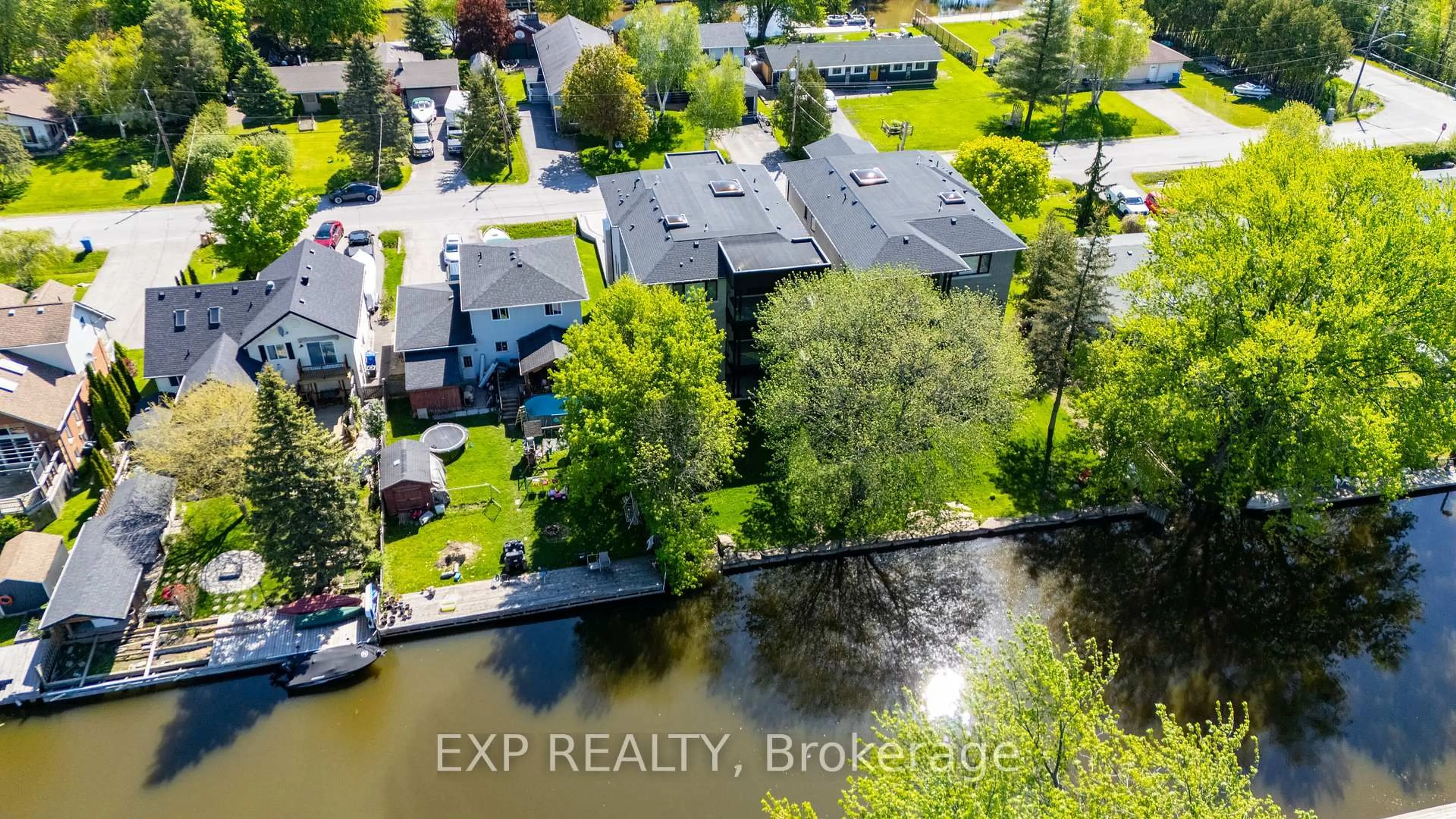A pic from outside/outdoor area/front of a property/back of a property/a pic from drone, water/lake/river/ocean view for 12 Canal St, Georgina Ontario L4P 1K5