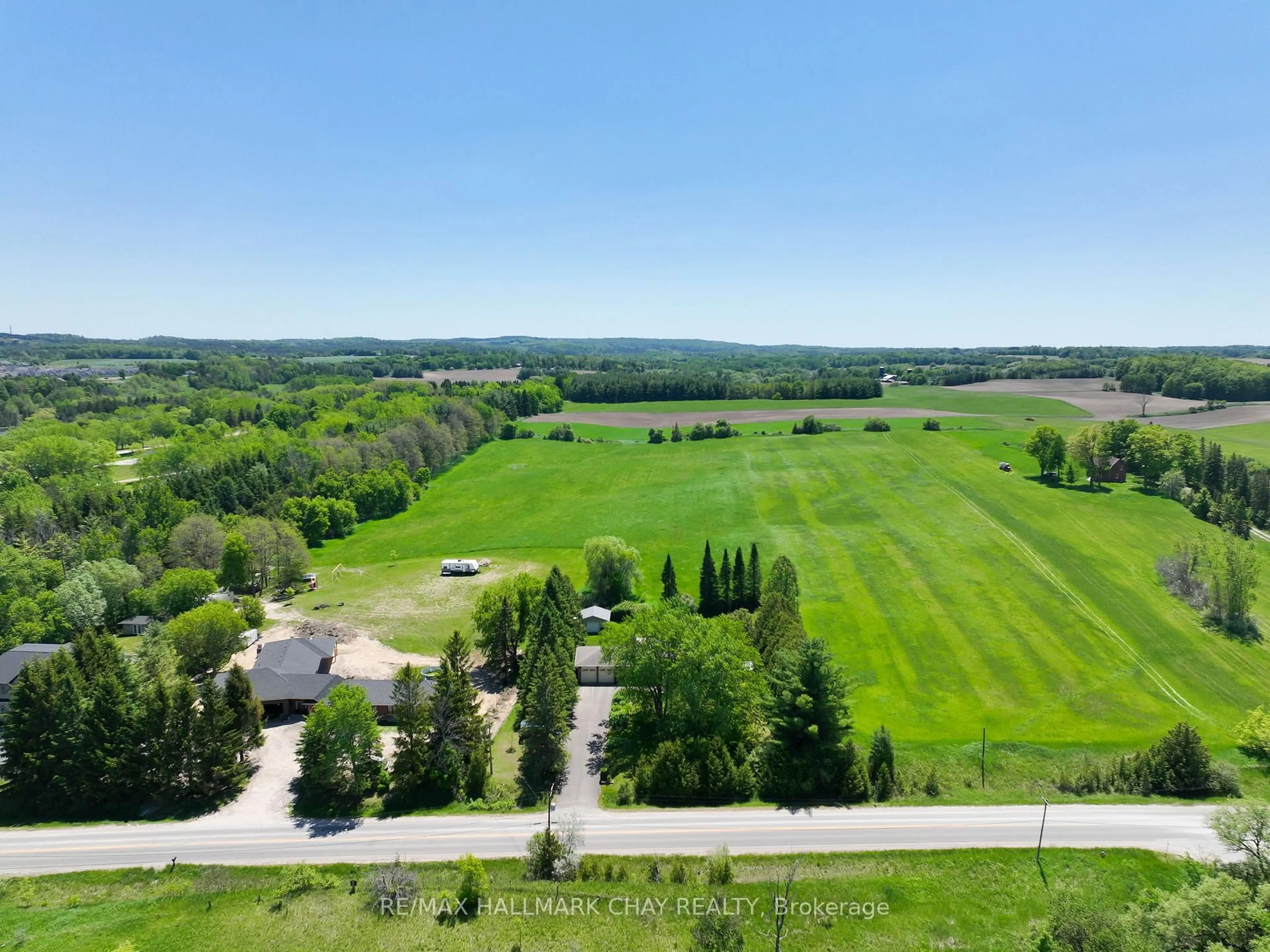 A pic from outside/outdoor area/front of a property/back of a property/a pic from drone, forest/trees view for 6815 4th Line, New Tecumseth Ontario L0G 1W0