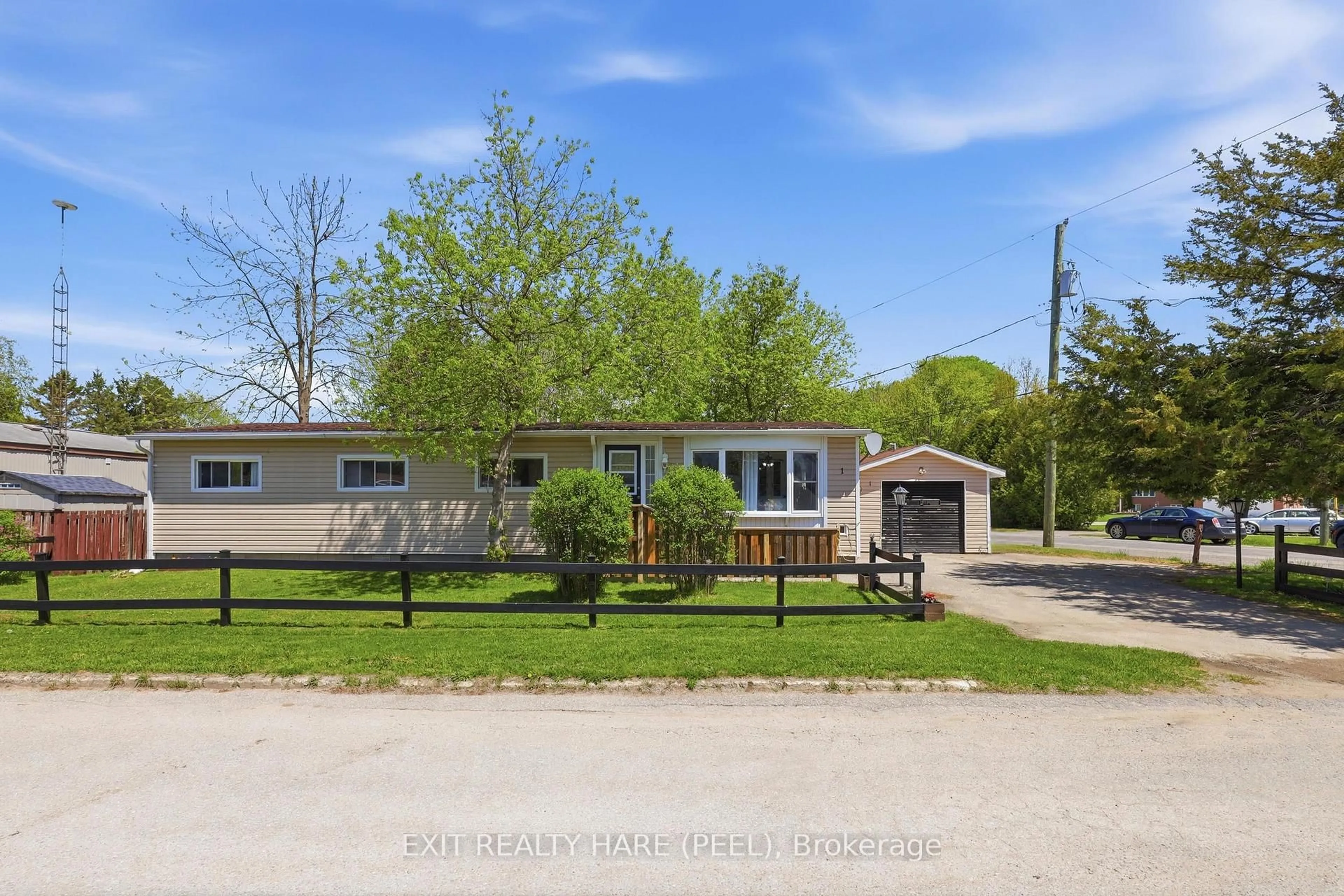 A pic from outside/outdoor area/front of a property/back of a property/a pic from drone, street for 1 Centre Park St, Essa Ontario L3W 0A5