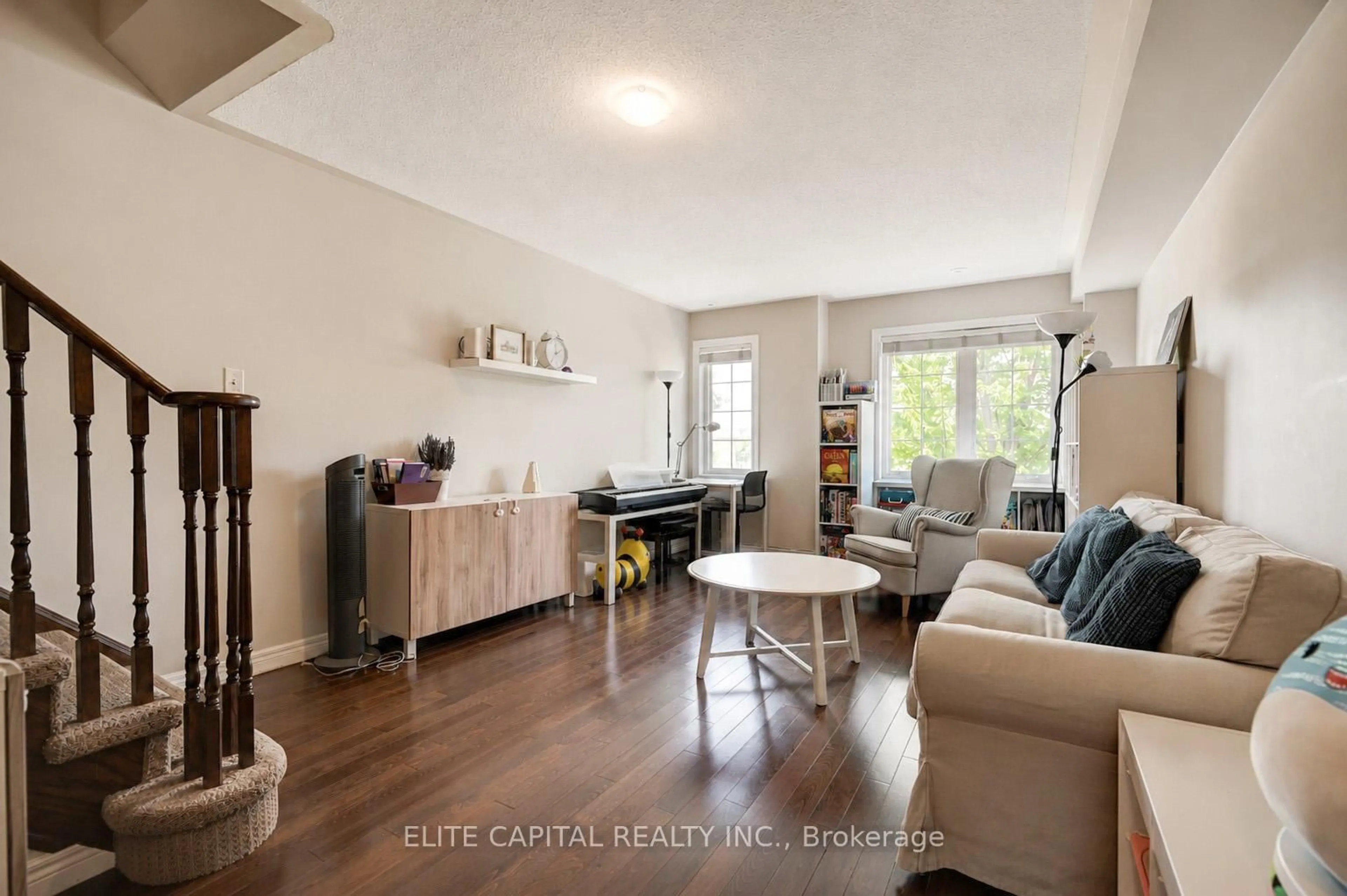 Living room with furniture, wood/laminate floor for 2696 Bur Oak Ave, Markham Ontario L6B 1H9