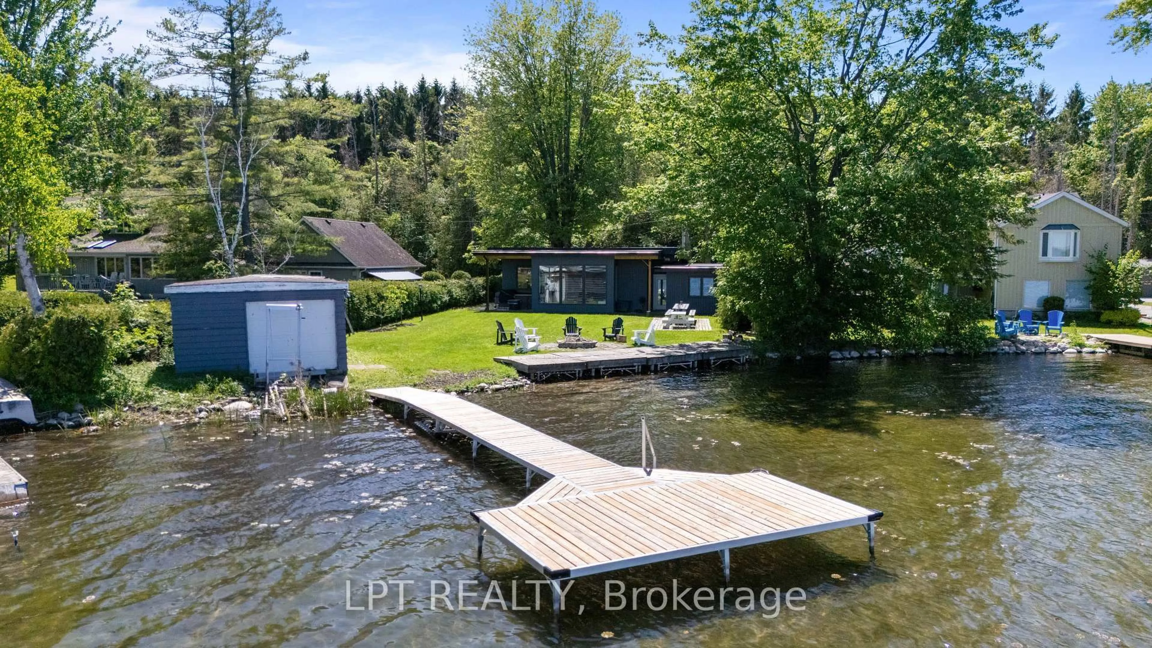 A pic from outside/outdoor area/front of a property/back of a property/a pic from drone, water/lake/river/ocean view for 23 Doyle Beach Lane, Georgina Ontario L0E 1R0