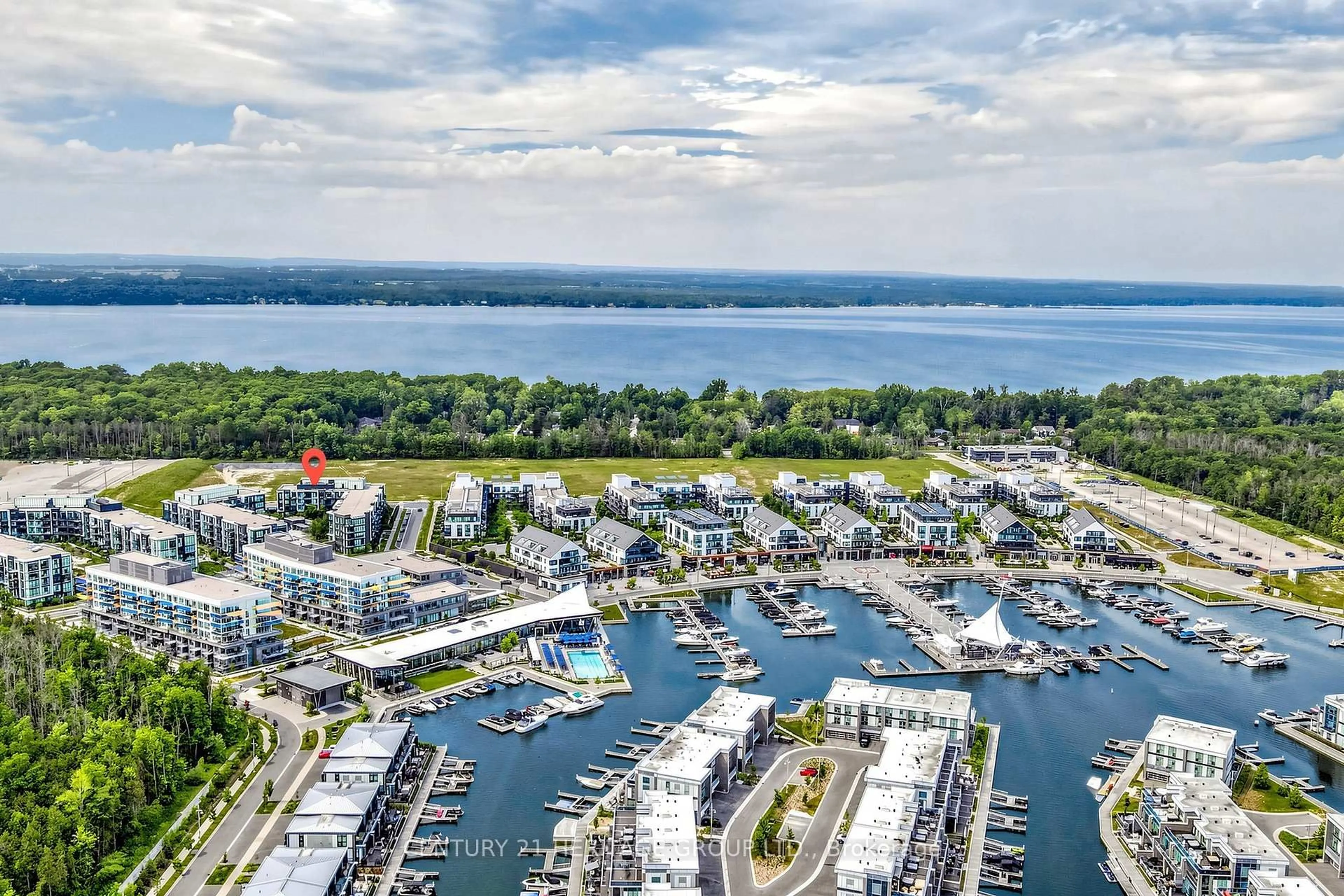 A pic from outside/outdoor area/front of a property/back of a property/a pic from drone, water/lake/river/ocean view for 375 Sea Ray Ave #202, Innisfil Ontario L9S 0N9