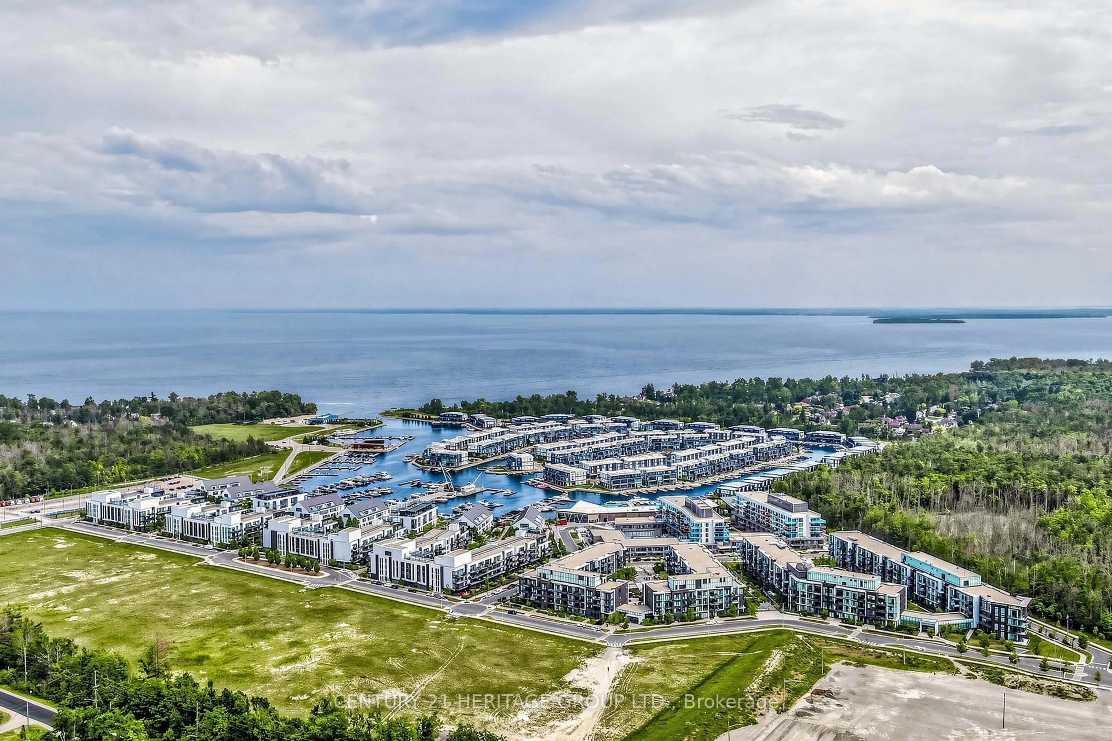 A pic from outside/outdoor area/front of a property/back of a property/a pic from drone, water/lake/river/ocean view for 375 Sea Ray Ave #202, Innisfil Ontario L9S 0N9