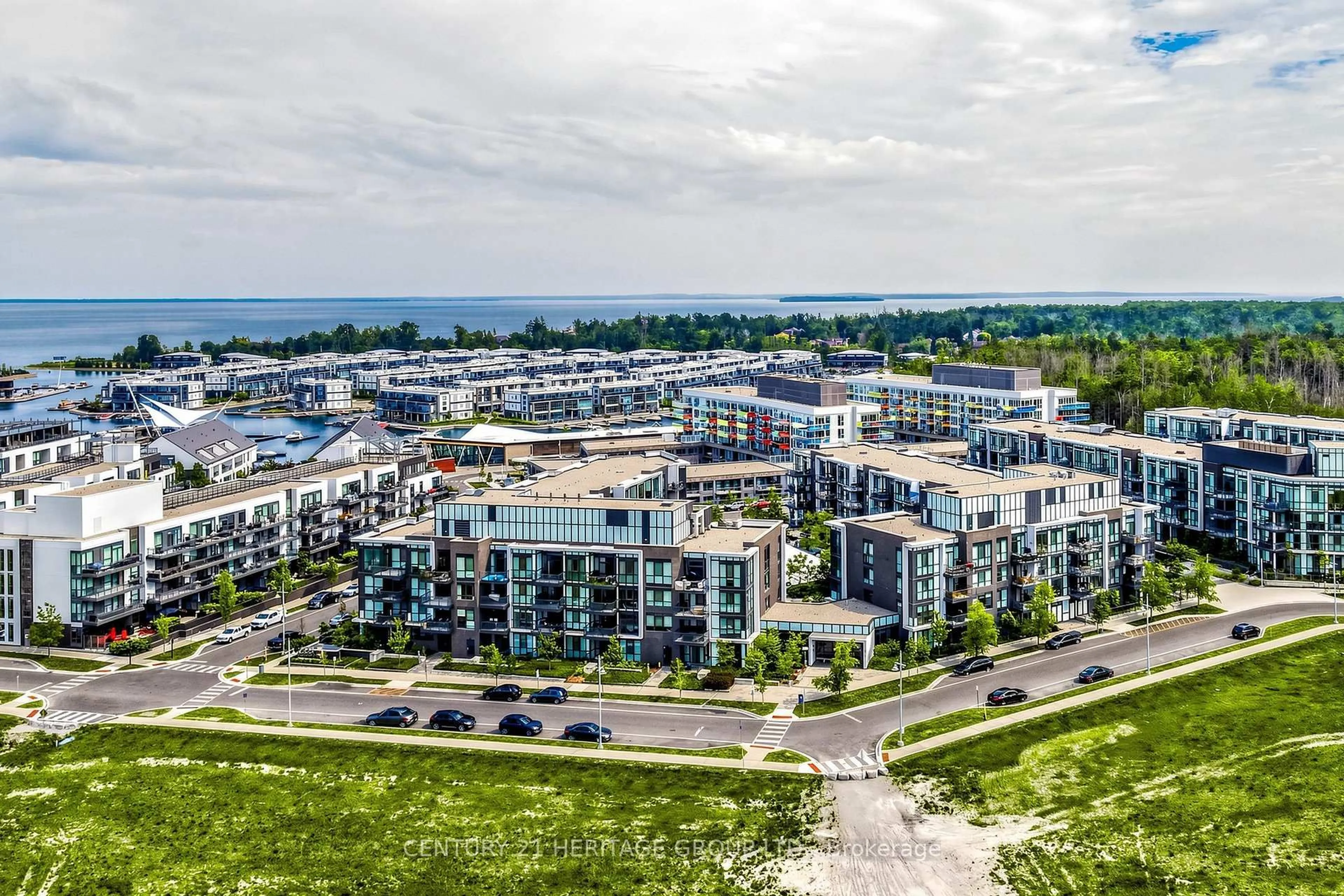 A pic from outside/outdoor area/front of a property/back of a property/a pic from drone, water/lake/river/ocean view for 375 Sea Ray Ave #202, Innisfil Ontario L9S 0N9