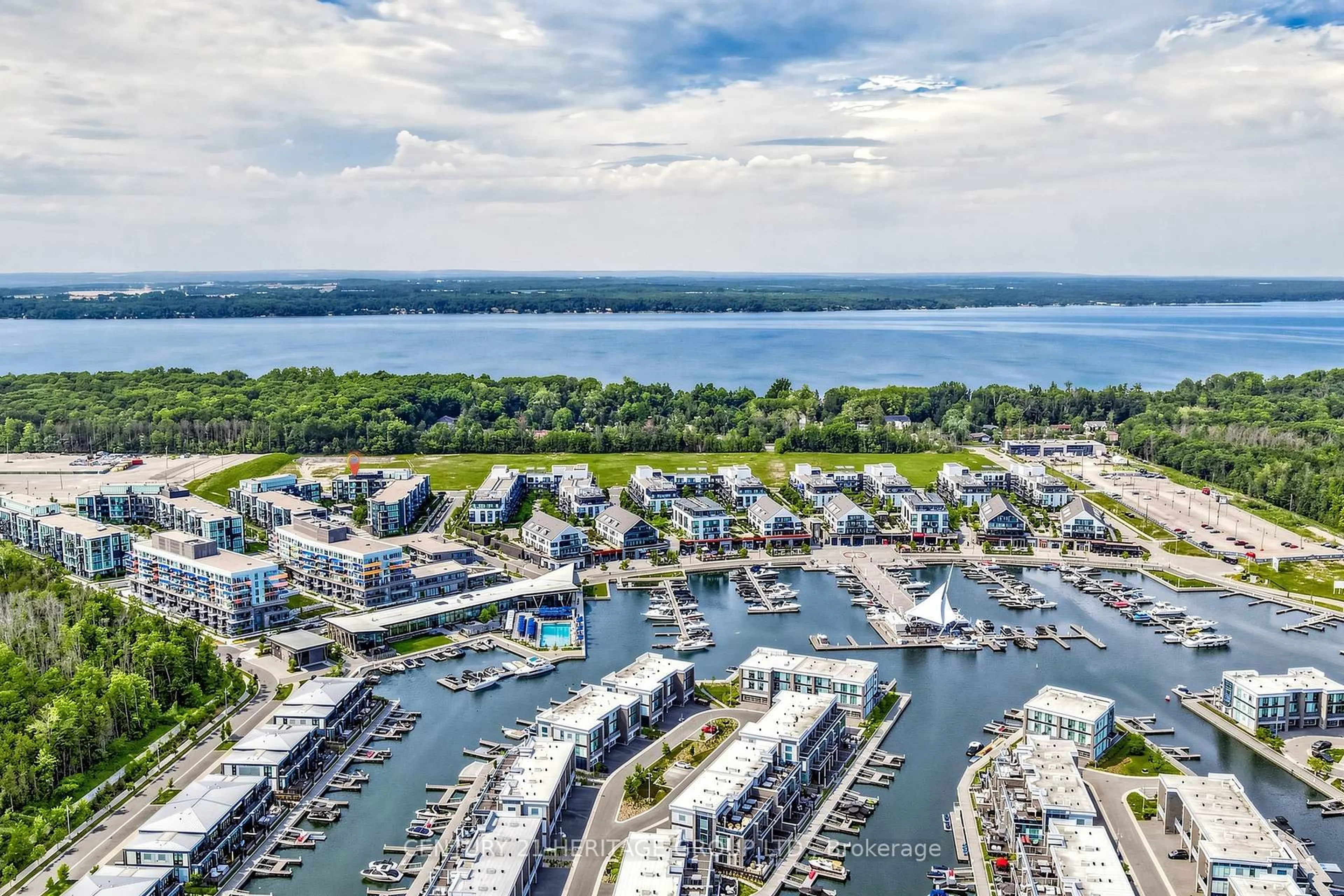 A pic from outside/outdoor area/front of a property/back of a property/a pic from drone, water/lake/river/ocean view for 375 Sea Ray Ave #202, Innisfil Ontario L9S 0N9
