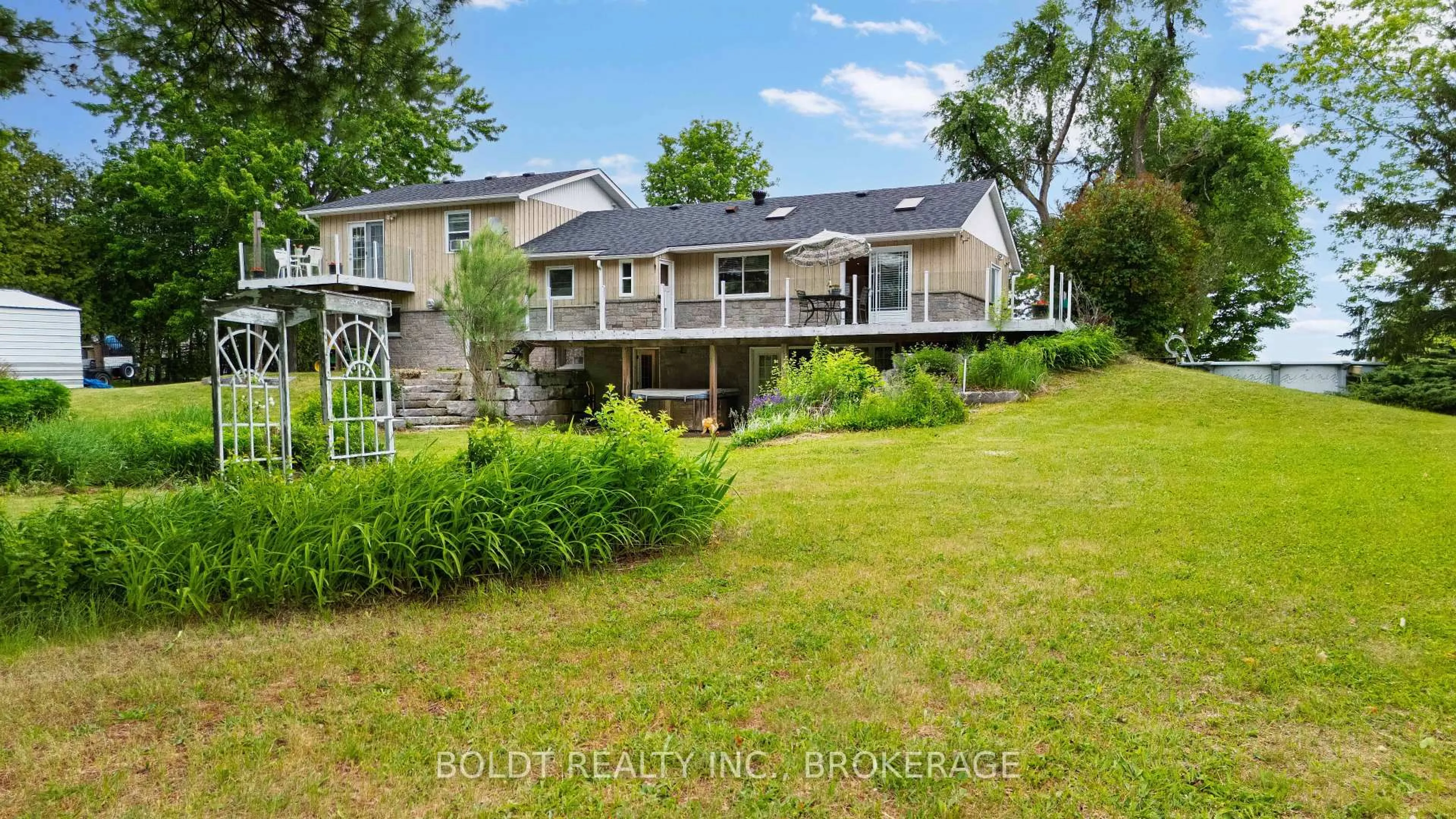 A pic from outside/outdoor area/front of a property/back of a property/a pic from drone, water/lake/river/ocean view for 5832 5th Sdrd, Innisfil Ontario L0L 1L0