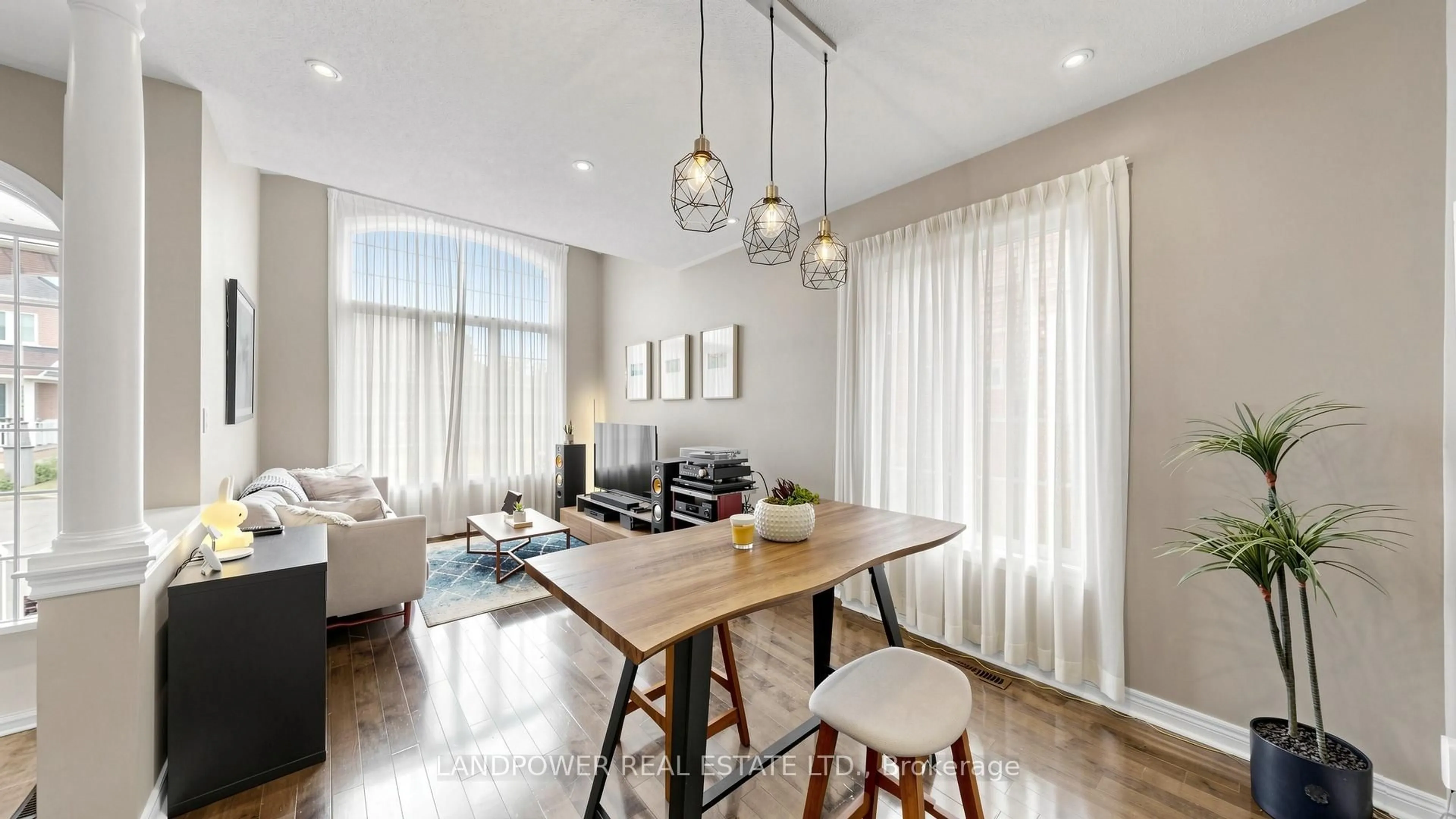 Living room with furniture, wood/laminate floor for 49 Winter Creek Cres, Markham Ontario L6C 3E3