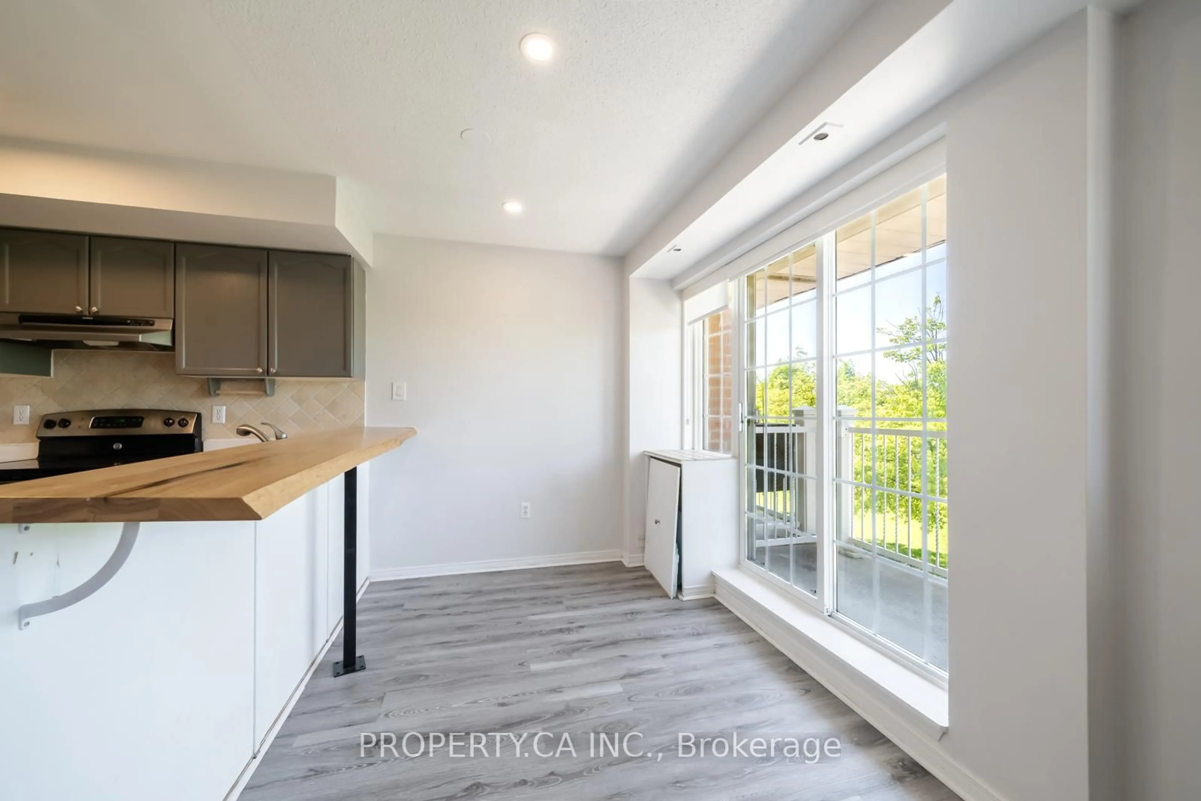 Open concept kitchen, wood/laminate floor for 15 Cornell Meadows Ave #A206, Markham Ontario L6B 1B6