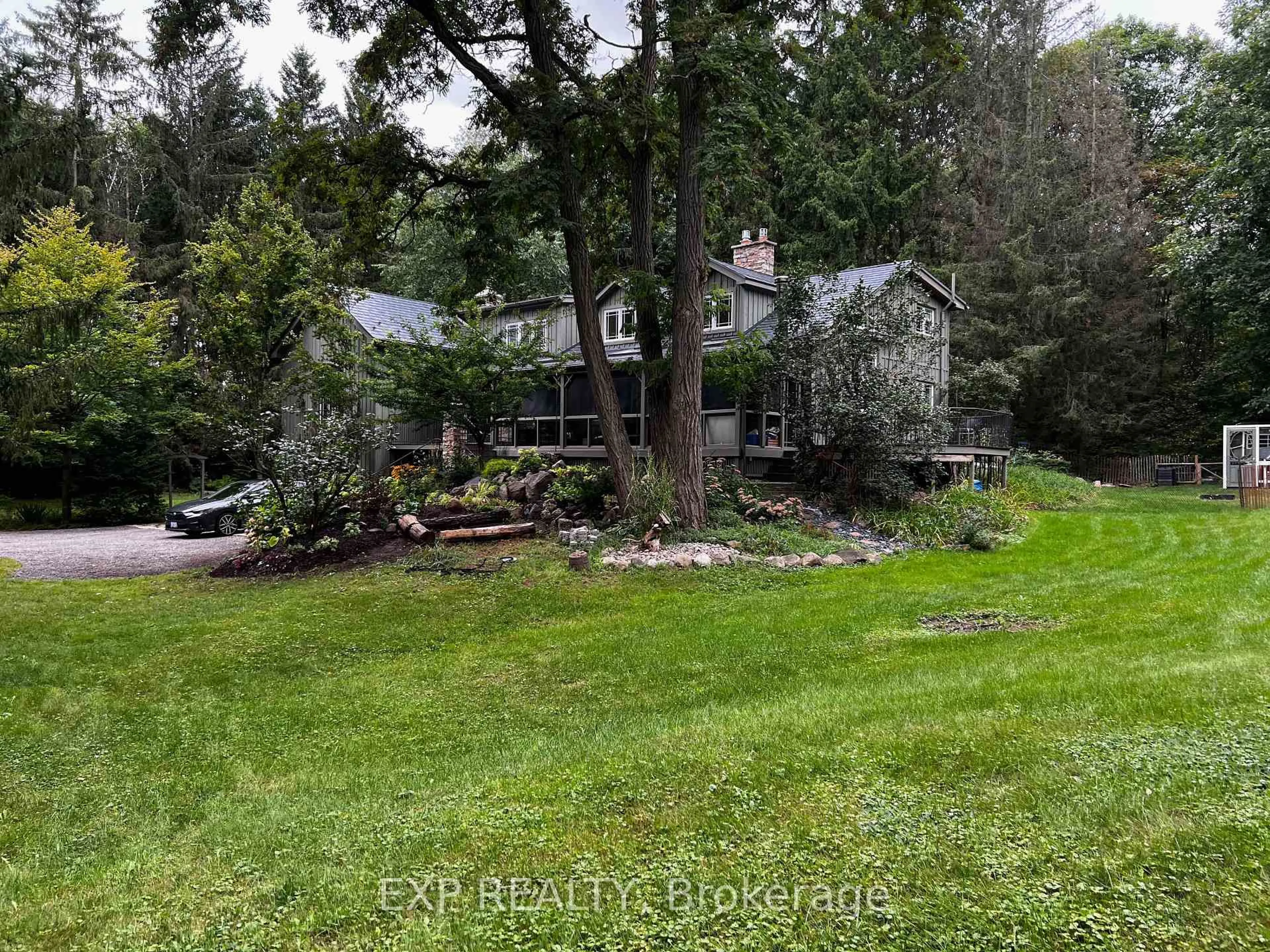 A pic from outside/outdoor area/front of a property/back of a property/a pic from drone, forest/trees view for 115 Fog Rd, King Ontario L7B 1A3