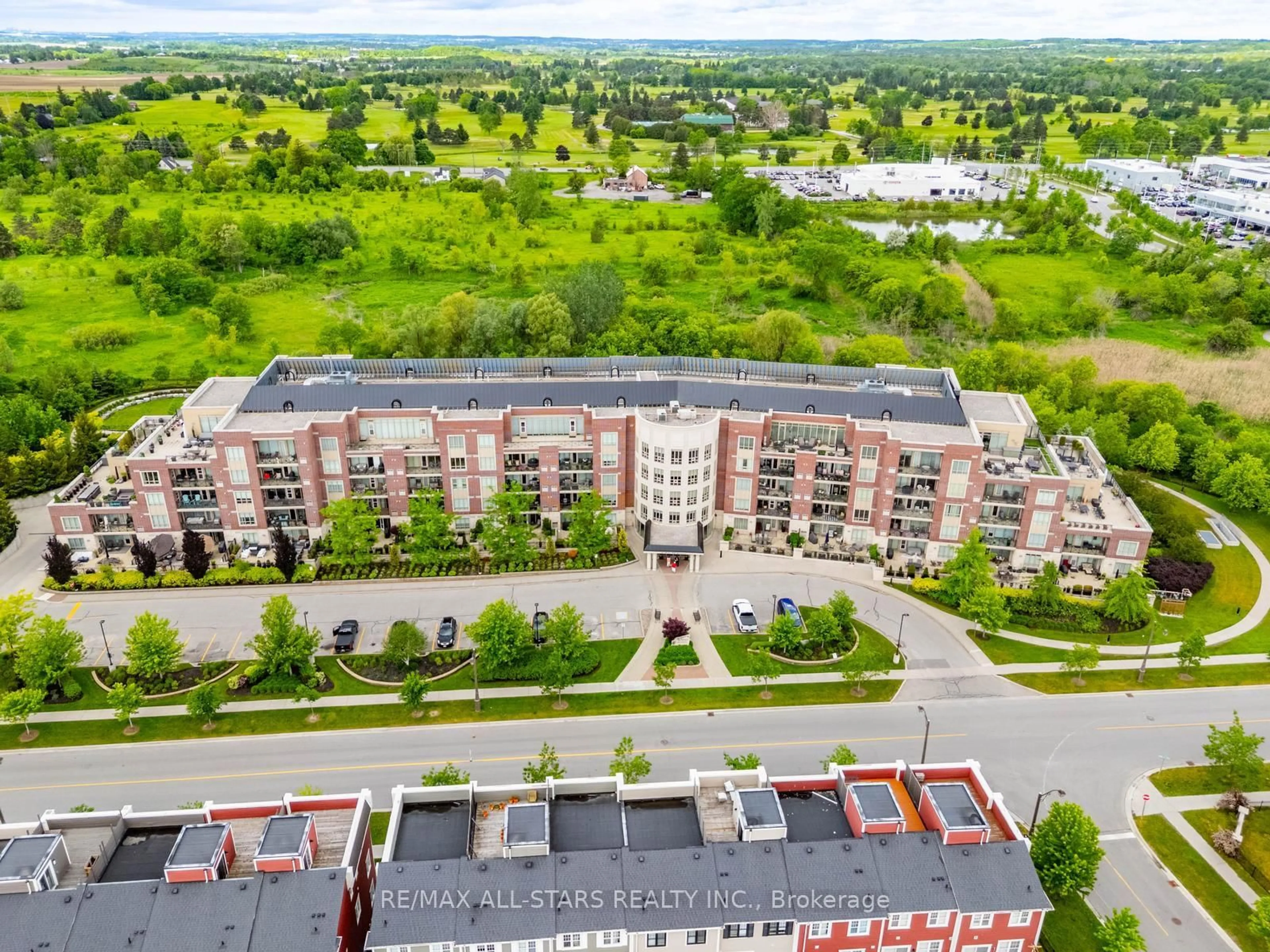 A pic from outside/outdoor area/front of a property/back of a property/a pic from drone, city buildings view from balcony for 35 Baker Hill Blvd #218, Whitchurch-Stouffville Ontario L4A 1P8