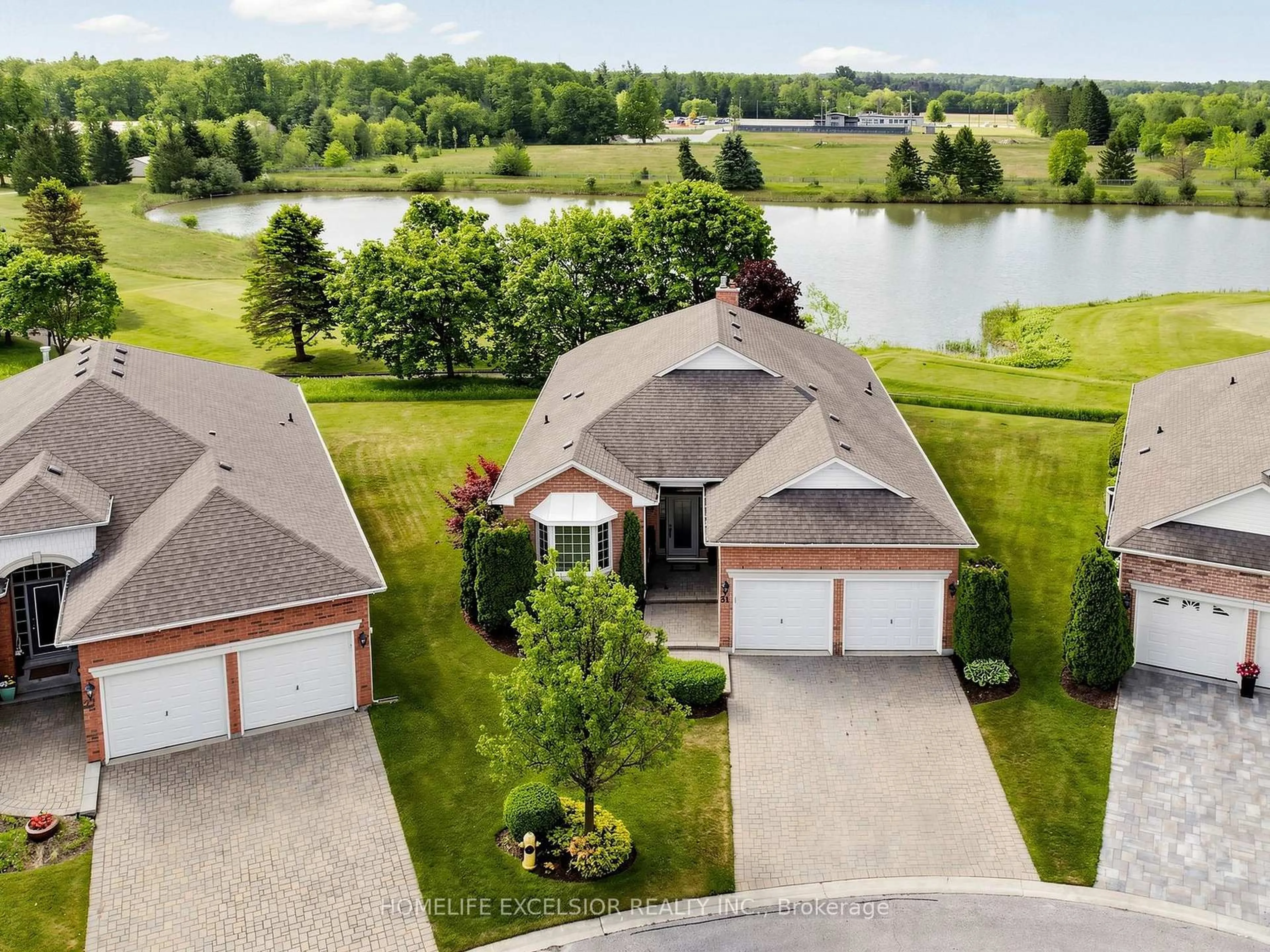 A pic from outside/outdoor area/front of a property/back of a property/a pic from drone, water/lake/river/ocean view for 31 Sneads Green #77, Whitchurch-Stouffville Ontario L4A 1M3