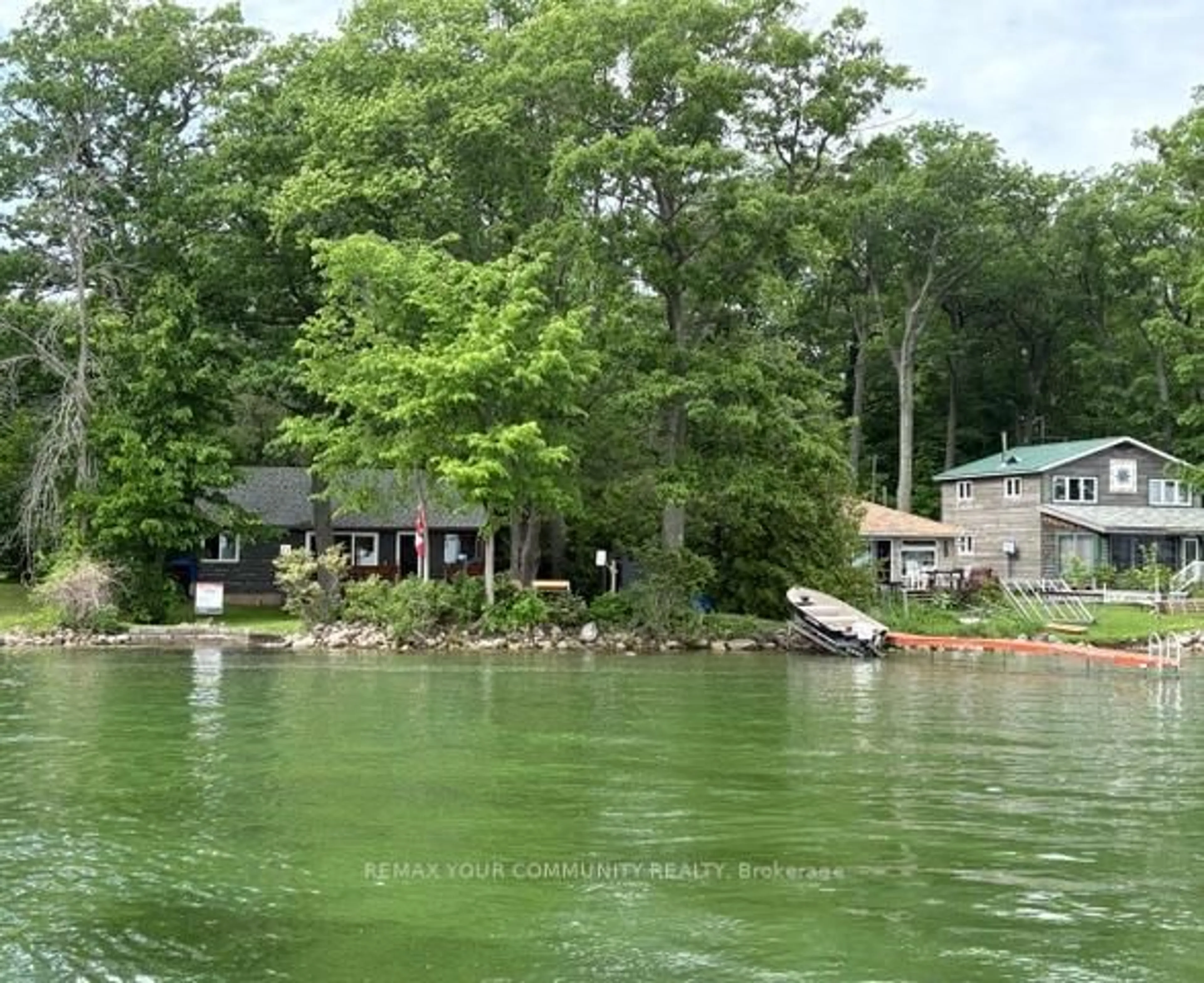 A pic from outside/outdoor area/front of a property/back of a property/a pic from drone, water/lake/river/ocean view for 58 Snake Island Rd, Georgina Islands Ontario L4P 3E9